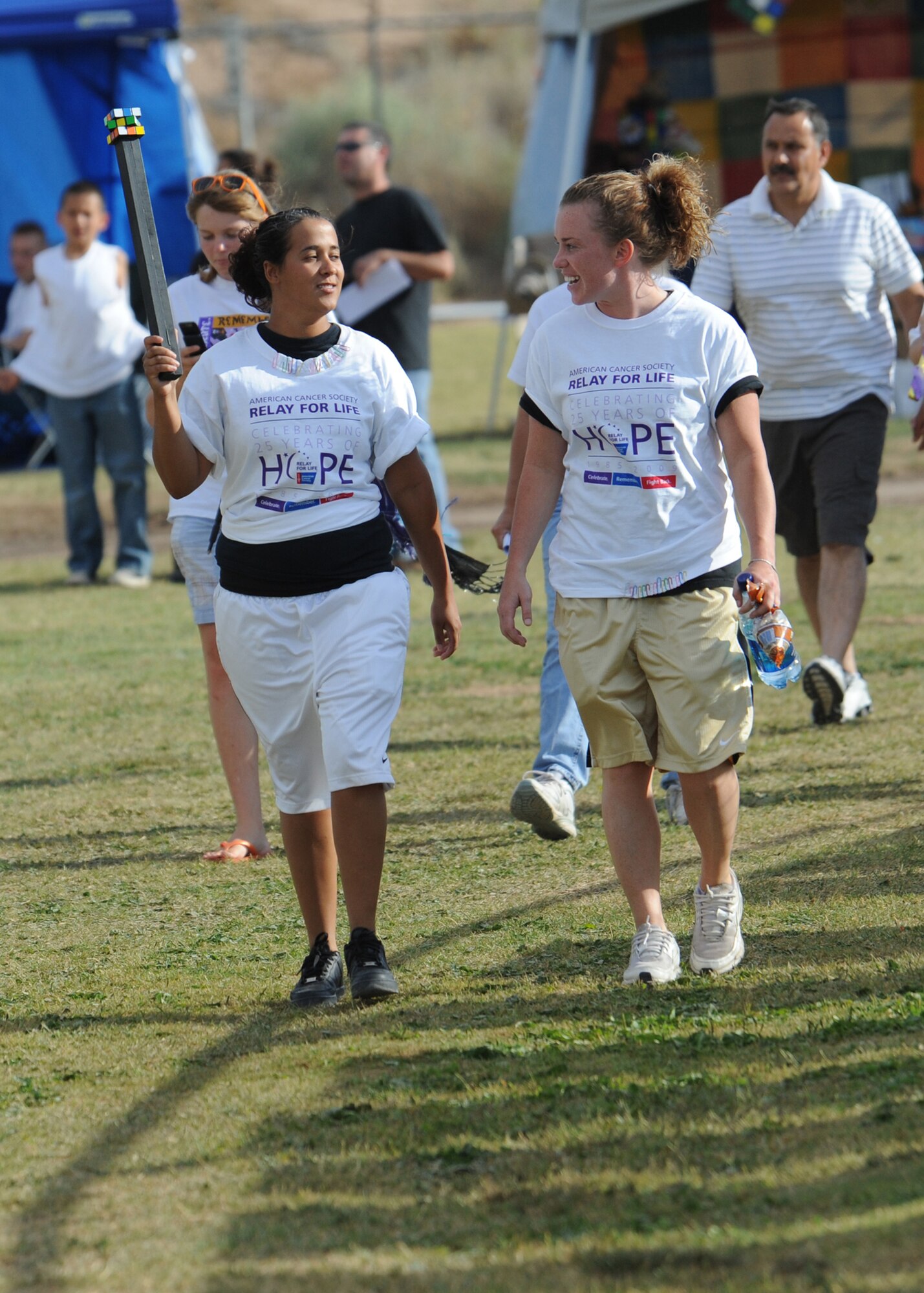 Airman 1st Class Krista Lawrence and Airman 1st Class Karla Jimenez, from the 49th Civil Engineer Squadron at Holloman Air Force Base, N.M., participate in the 10th Annual Otero County Relay for Life fundraiser in Alamogordo N.M., May 30. The relay brings awarness to the community and raises money for the American Cancer Society. (U.S. Air Force photo/Senior Airman Michael Means)