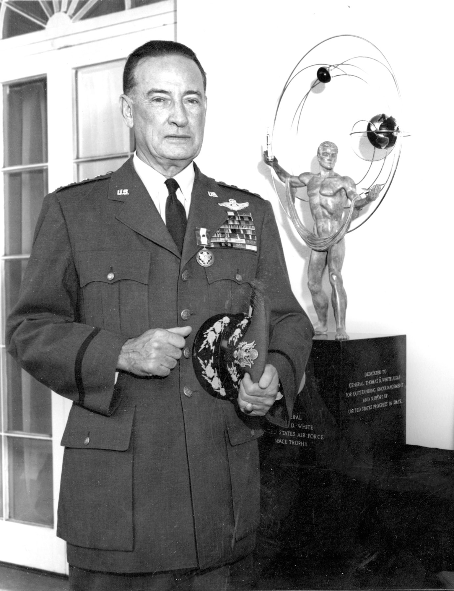 Gen. T.D. White and the trophy that bears his name. He is shown here wearing the Distinguished Service Medal, awarded for a career of outstanding leadership.(U.S. Air Force photo)