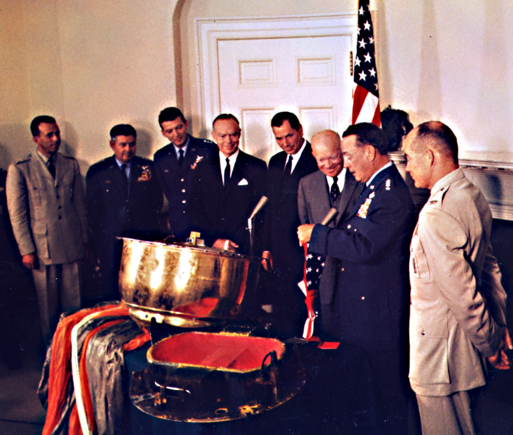 The Discoverer reconnaissance satellites heralded an era of powerful USAF space capabilities. In this photo, Gen. T.D. White presents an American flag flown on Discoverer XIII to President Dwight Eisenhower. (U.S. Air Force photo)