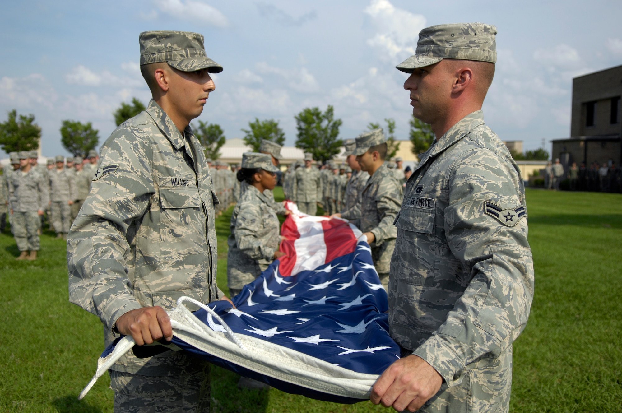 SHAW AIR FORCE BASE, S.C. -- Members of the Shaw AFB Honor Guard fold the flag at the 9th Air Force Headquarters flag pole during the 2009 Memorial Day Retreat Ceremony, May 29. The 20th Fighter Wing held the ceremony in memory of those who were lost in prior conflicts and the 11 Airmen who gave their lives in the last year in Iraq and Afghanistan. (U.S. Air Force photo/Senior Airman Kathrine McDowell)