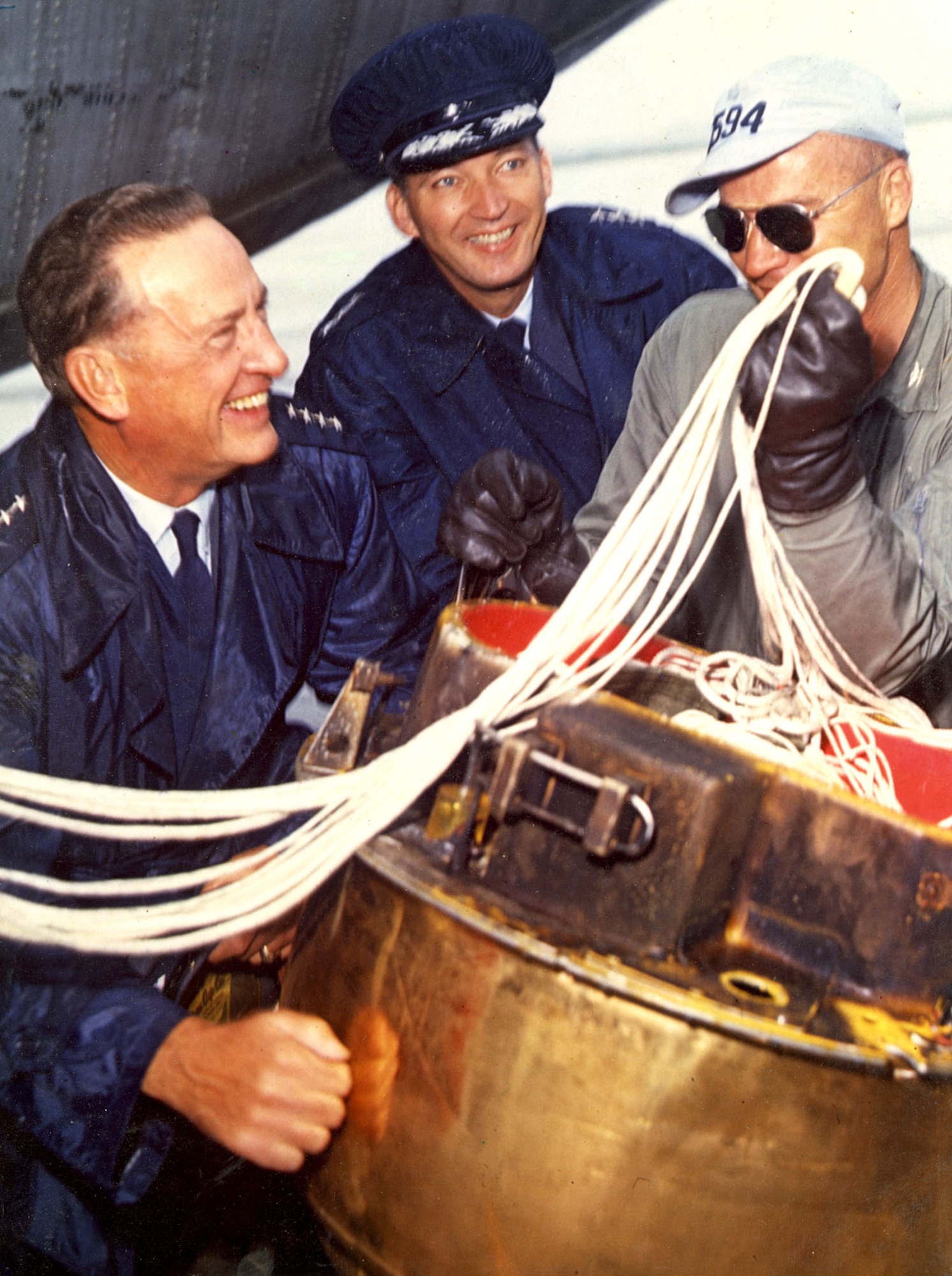 Gen. T.D. White (left) after the successful mid-air recovery of Discoverer XIII, the first man-made object recovered from orbit, in 1960. It was the forerunner of many successful Air Force satellites. (U.S. Air Force photo)