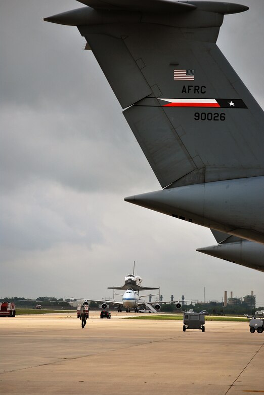 Space Shuttle Atlantis made a pit-stop, to a parking area near the 433rd Airlift Wing at Lackland AFB, Texas, today (June 2, 2009). The shuttle is on its way home to Kennedy Space Center, Fla., from the landing site at Edwards AFB, Calif. According to Ms. Candrea Thomas, public affairs officer at NASA's Kennedy Space Center, Atlantis was returning from "STS Mission 125" where the crew serviced and upgraded the Hubble Space Telescope on the International Space Station. Weather caused a delay and relocation of the landing site. After landing at Edwards AFB, Atlantis was "piggybacked" onto a modified Boeing 747 called a shuttle carrier. The 747 then flew from Edwards to El Paso, Texas and spent the night waiting for severe thunder storms to pass. Next stop was the Lackland AFB flight line. The shuttle carrier took on fuel while parked near the Alamo Wing"s C-5 Galaxy parking ramp. From here, the shuttle plans a stop in Columbus, Ohio and is expected back in Florida early in the evening. (U.S. Air Force Photo/Master Sgt. Collen McGee) 