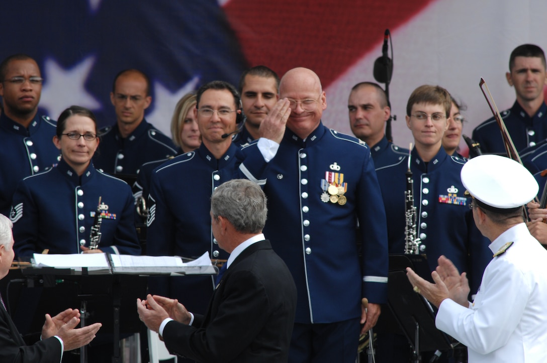 Sept. 11, 2008:  Colonel Layendecker salutes when President Bush, Secretary of Defense Robert Gates, and Chairman of Joint Chiefs of Staff Admiral Mike Mullen turn to applaud The USAF Band during the Dedication Ceremony of the 9/11 Memorial. (USAF photo by Andy Morateya)