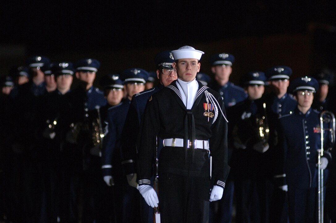 Dec. 2006:  The Ceremonial Honor Guard and United States Air Force Band stand at the ready as the casket of Gerald R. Ford, 38th President of the United States, arrives at Andrews Air Force Base. (Photo by Technical Sgt. Christopher Matthews) 