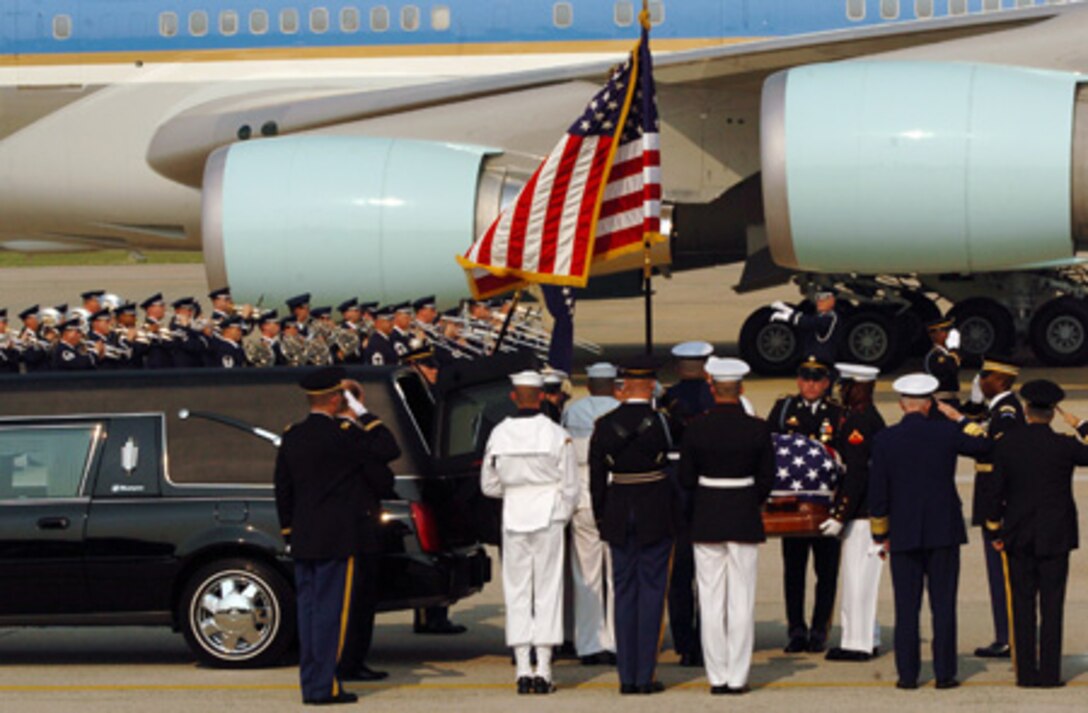 June 2004:  Colonel Layendecker conducts the Ceremonial Brass as the remains of President Ronald Reagan arrive at Andrews Air Force Base for state funeral services.  (U.S. Navy photo)