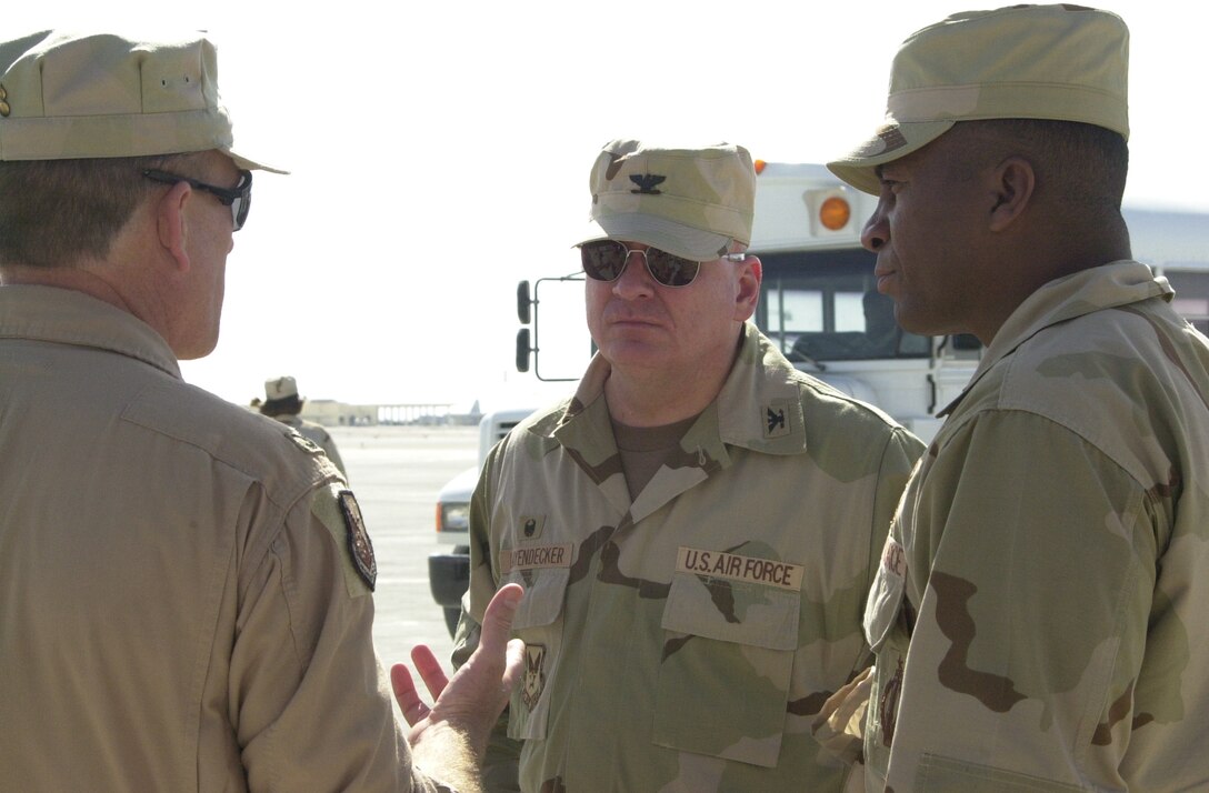 Dec. 2003:  Colonel Layendecker and former 11th Operations Group Deputy Commander, Lieutenant Colonel Bruce Alexander, are greeted upon their arrival at Al Udeid Air Base, Qatar. They accompanied The USAF Band performing unit, High Flight, who entertained deployed U.S. troops stationed in the Middle East. (Photo by Staff Sgt. Nicole O’Hare)