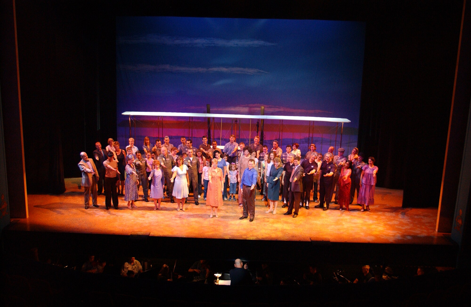 Oct. 2003:  Members of the “Born of a Dream” cast acknowledge Colonel Layendecker following a performance at the National Theatre in Washington, DC.  “Born of a Dream,” the Band’s first all-original Broadway-style production, was also performed at the famous Kodak Theatre in Hollywood, California. (USAF photo) 