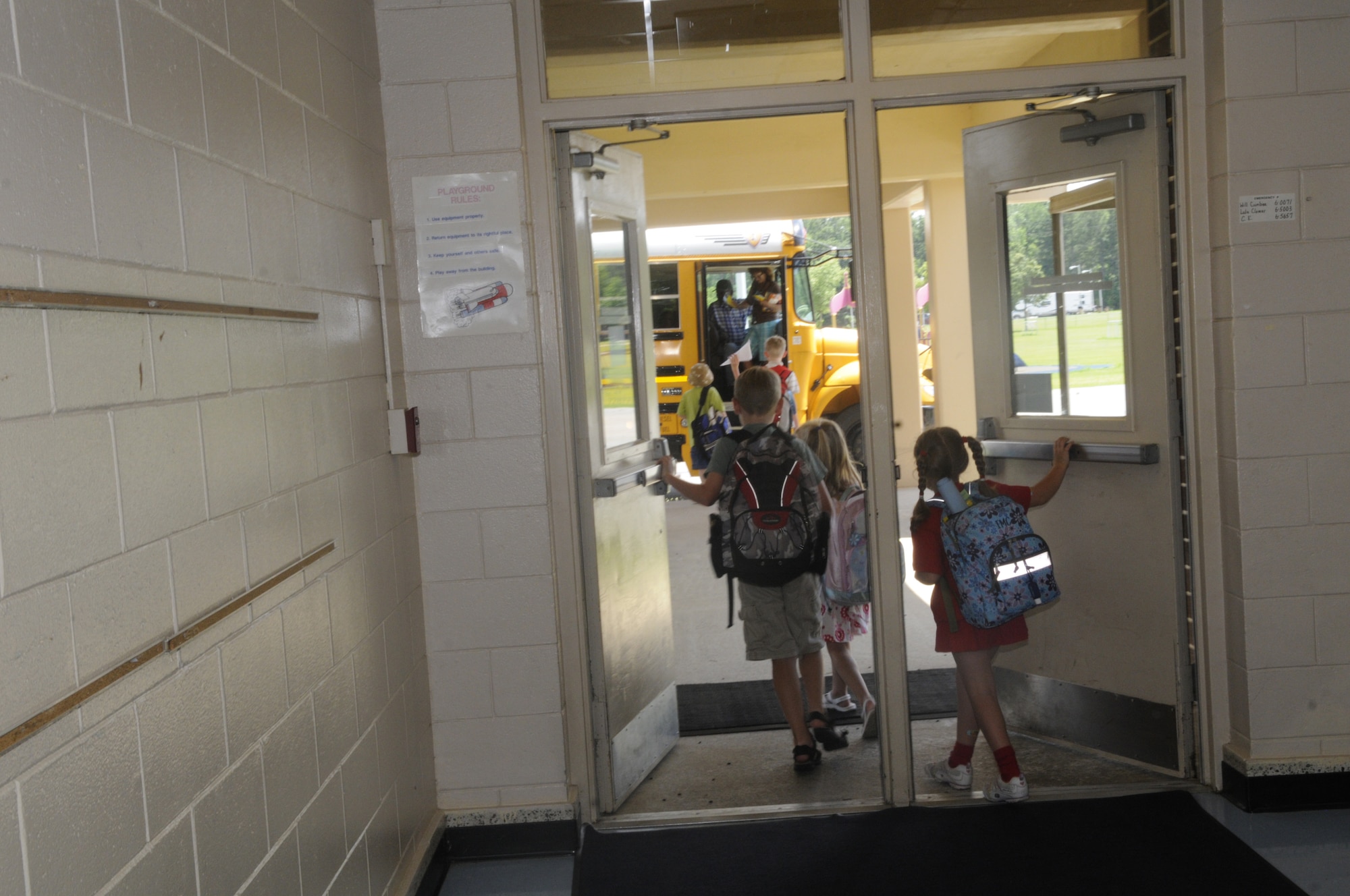 Robins Elementary students head toward an awaiting school  bus after the final bell May 28. U. S. Air Force photo by Sue Sapp