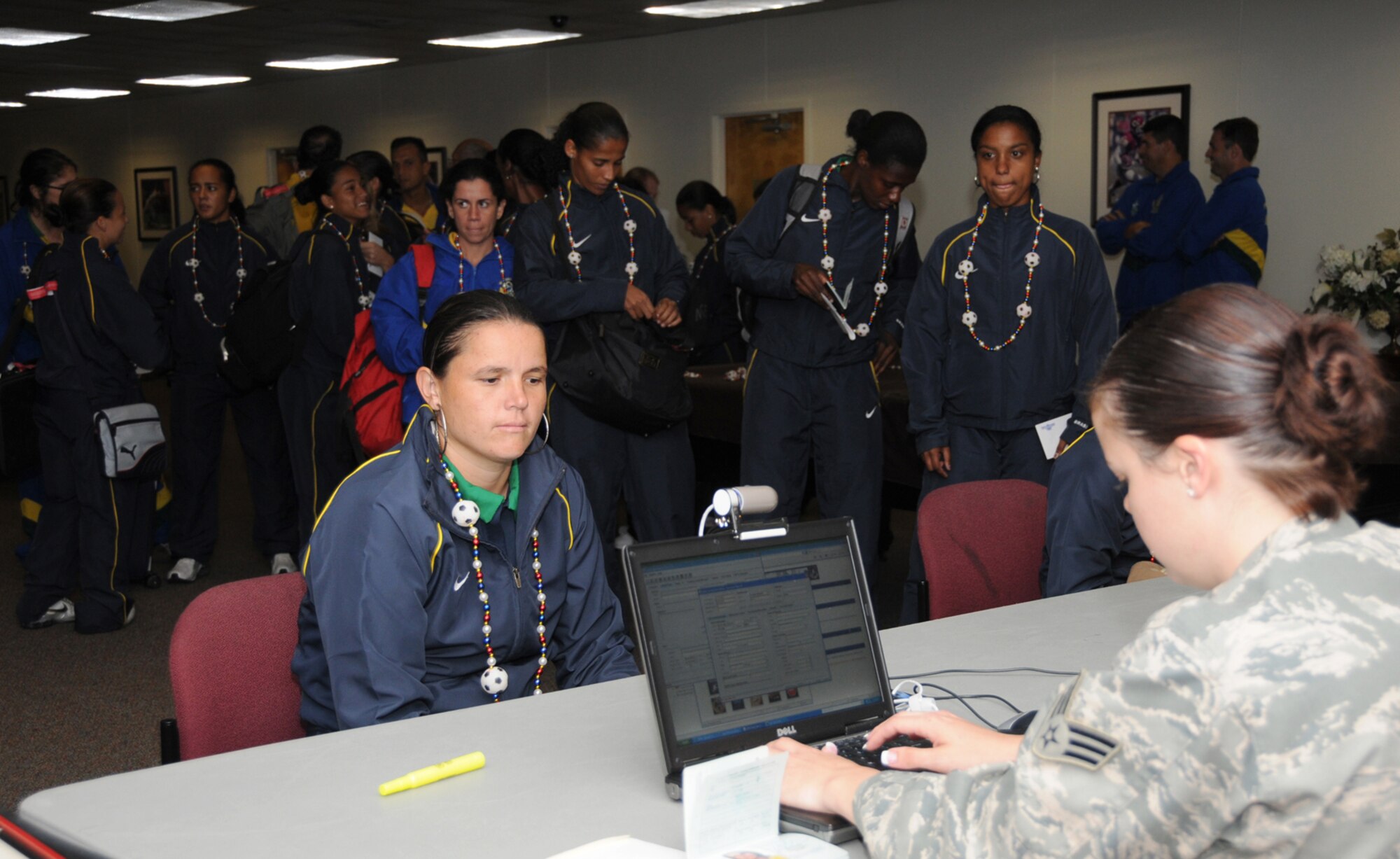 Vanessa Cataneo, left, from Brazil goes through inprocessing at Keesler's
Muse Manor June 3 with Senior Airman Rebecca Turknett, 81st Security Forces
Squadron.  The Brazilian team was the first of six foreign teams to arrive
for the Conseil International du Sport Militaire 5th Women's World Military
Football (Soccer) Championship hosted by Keesler.  Games begin June 6, with
the championship game at 2 p.m. June 13 at the Biloxi High School stadium.
In addition to the U.S. and Brazilian teams, other competitors are from The
Netherlands, France, Canada, South Korea and Germany.  (U.S. Air Force photo by Kemberly Groue)
