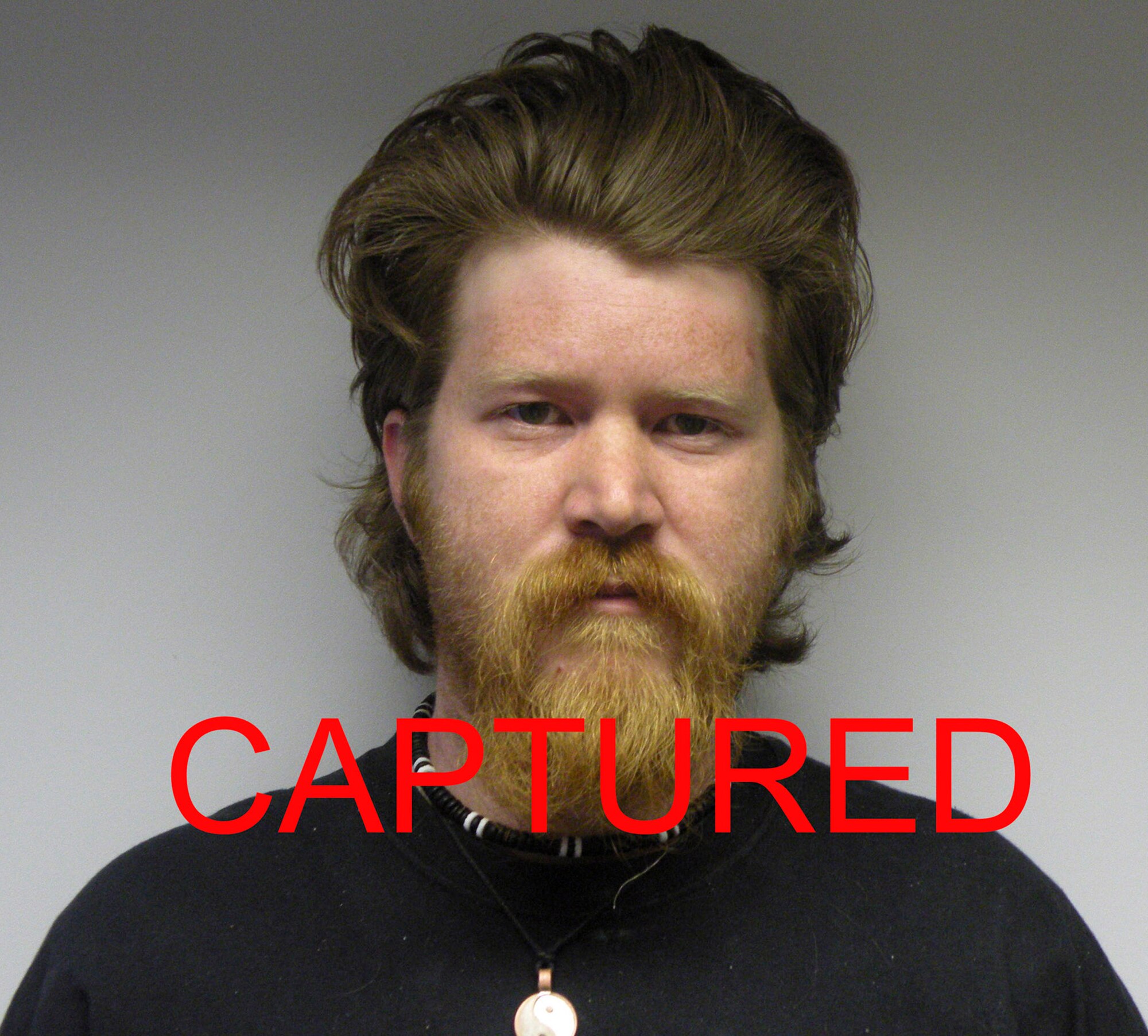 Airman Basic Jeremy Parrott was apprehended June 3 at approximately 8 p.m. in Ipswich, England. He escaped Air Force custody in September 2008 after being charged with possession of child pornography and sentenced to three years of confinement in July 2008. (U.S. Air Force photo illustration)