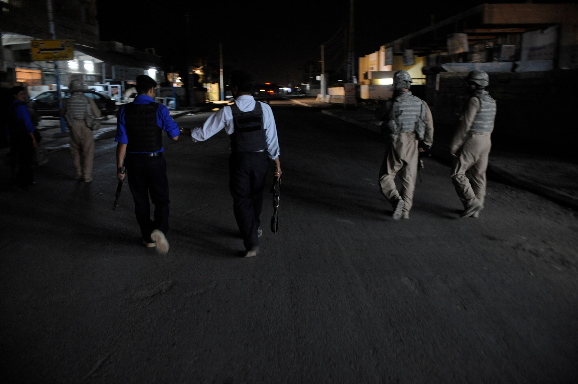 U.S. Air Force Airmen of the 732nd Expeditionary Security Forces Squadron Det. 3 conduct a presence patrol with Iraqi Policemen May 13, 2009, in Baghdad. (U.S. Air Force Photo by Staff Sgt. Shawn Weismiller)