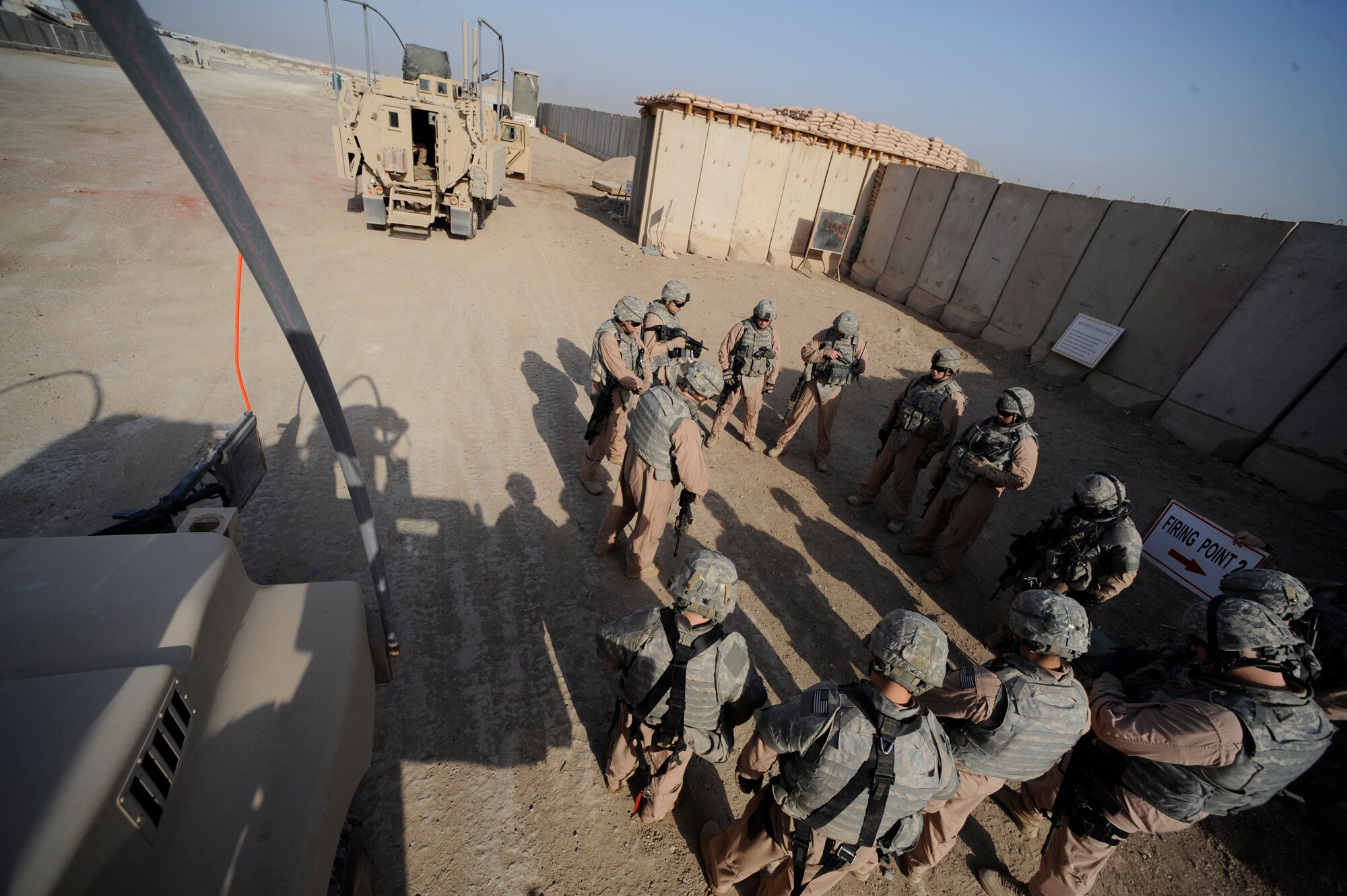 U.S. Air Force Airmen of the 732nd Expeditionary Security Forces Squadron Det. 3 share a moment of silence before departing for a mission May 12, 2009, in Baghdad. (U.S. Air Force Photo by Staff Sgt. Shawn Weismiller)