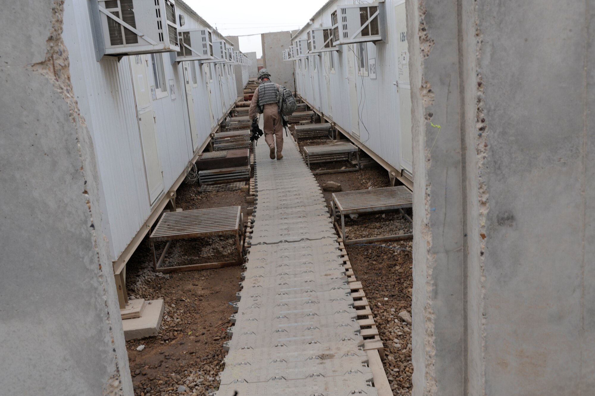 A U.S. Air Force Airman of the 732nd Expeditionary Security Forces Squadron Det. 3 walks to his room upon returning from military operations May 10, 2009, in Baghdad. (U.S. Air Force Photo by Staff Sgt. Shawn Weismiller)