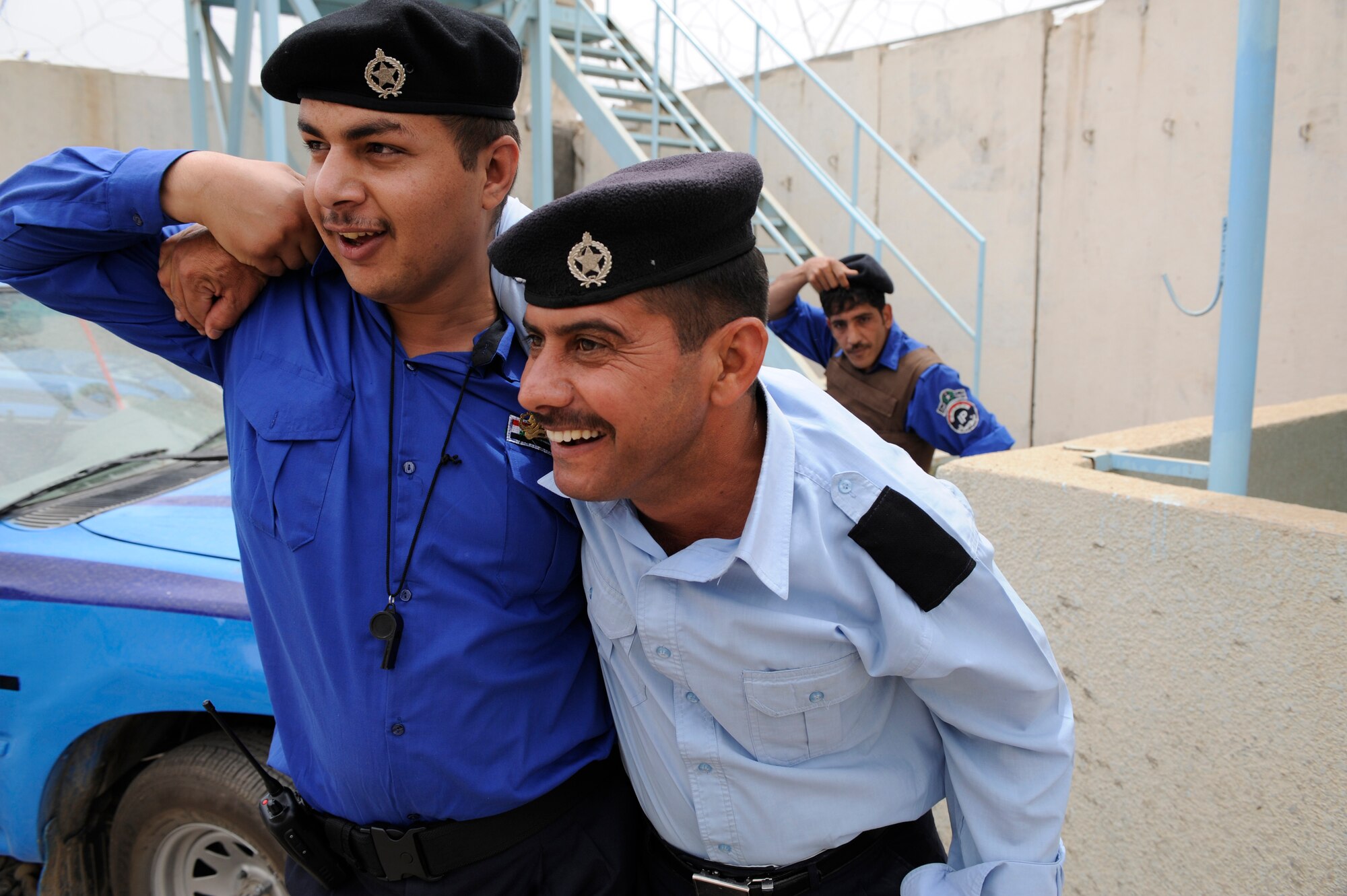 As part of a training exercise an Iraqi Policemen carries a wounded man to medical care May 10, 2009, in Baghdad. The Policemen were participating in a training scenario conducted by U.S. Air Force Airmen of the 732nd Expeditionary Security Forces Squadron. The Airmen are assigned to Forward Operating Base Falcon to train local Iraqi Police. These Airmen are responsible  for numerous Iraqi Police Stations within Southern Baghdad. Detachment 3 is made up of Airmen from over fifty bases throughout the United States, Europe and Asia.   (U.S. Air Force Photo by Staff Sgt. Shawn Weismiller)