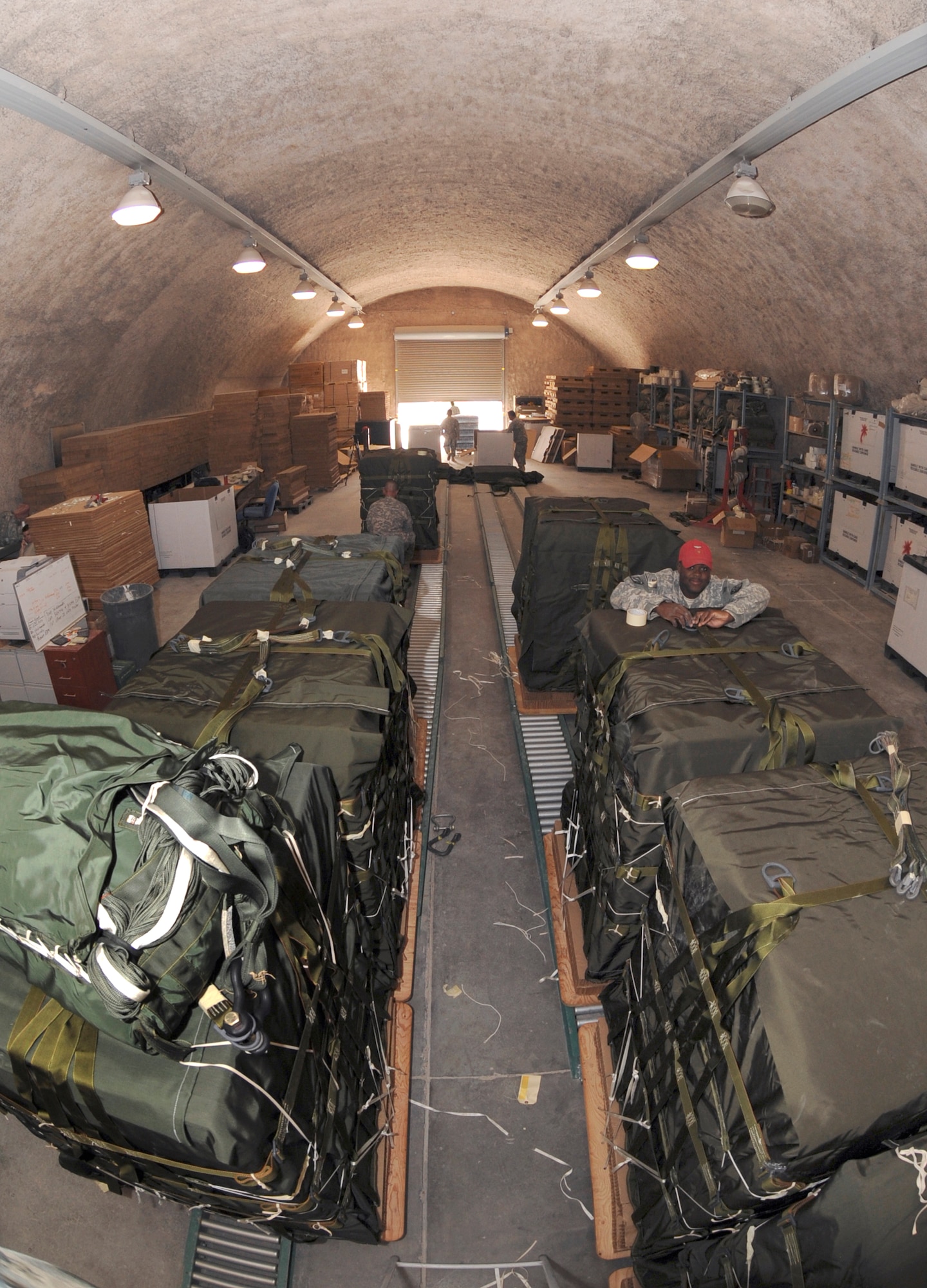 U.S. Army Riggers, with the 824th Quarter Master Company, prepare A22-Container Delivery Systems for an airdrop, June 3, 2009, in an undisclosed location in Southwest Asia.  Riggers provide vital supplies to servicemembers throughout the U.S. Central Command's area of responsibility by preparing these supply pallets for air-drop delivery by C-17 Globemaster III aircraft. All the soldiers are deployed from Fort Bragg N.C. in support of Operations Iraqi and Enduring Freedom and Combined Joint Task Force - Horn of Africa.  (U.S. Air Force Photo by Staff Sgt. Joshua Garcia/released)