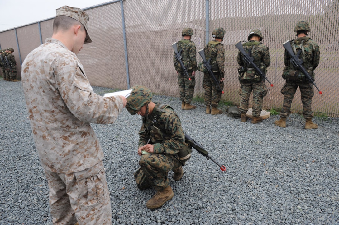 Candidates from Golf Company, Officer Candidate School, conduct the Leadership Reaction Course aboard Marine Corps Base Quantico, Va., June 4, 2009. The LRC is designed to test a candidate's quick thinking and problem solving skills and encourage team work among the candidates. (U.S. Marine Corps photo by LCpl John Kennicutt/Not Released)