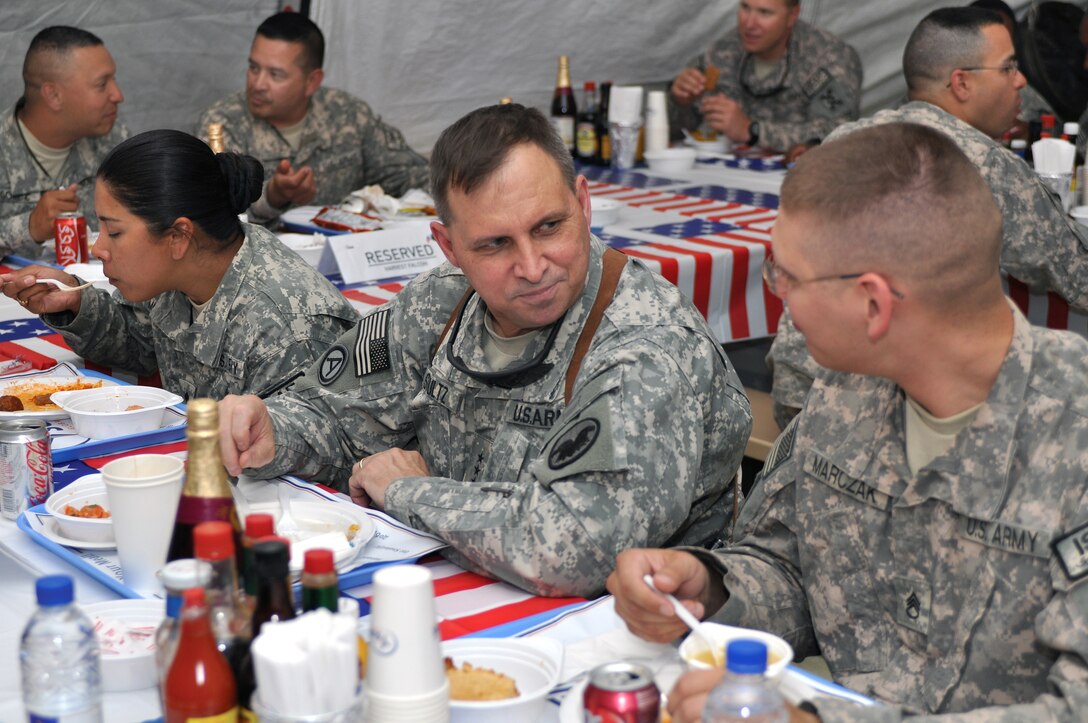 U.S. Army Lt. Gen. Jack C. Stultz Jr., commanding general, U.S. Army Reserve Command, visits with reservist Staff Sgt. David Marczak while eating lunch with troops at the Harvest Falcon Dining Facility, Kandahar Airfield, Afghanistan, June 4, 2009. Marczak a paralegal and is assigned to Joint Sustainment Command-Afghanistan.