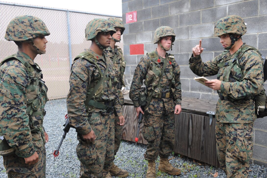 Candidates from Golf Company, Officer Candidate School, conduct the Leadership Reaction Course aboard Marine Corps Base Quantico, Va., June 4, 2009. The LRC is designed to test a candidate's quick thinking and problem solving skills and encourage team work among the candidates. (U.S. Marine Corps photo by LCpl John Kennicutt/Not Released)