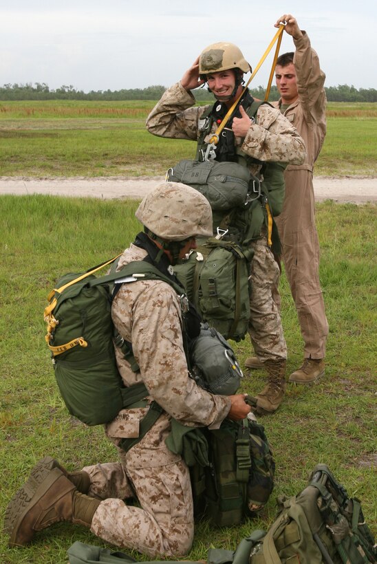 Prior to jump training here, June 5, Sgt. Peter Simmons, 2nd Radio Battalion, II Marine Expeditionary Force, has his gear inspected by a jump master to check for safety. (Official U.S. Marine Corps photo by Lance Cpl. John A. Faria) (RELEASED)