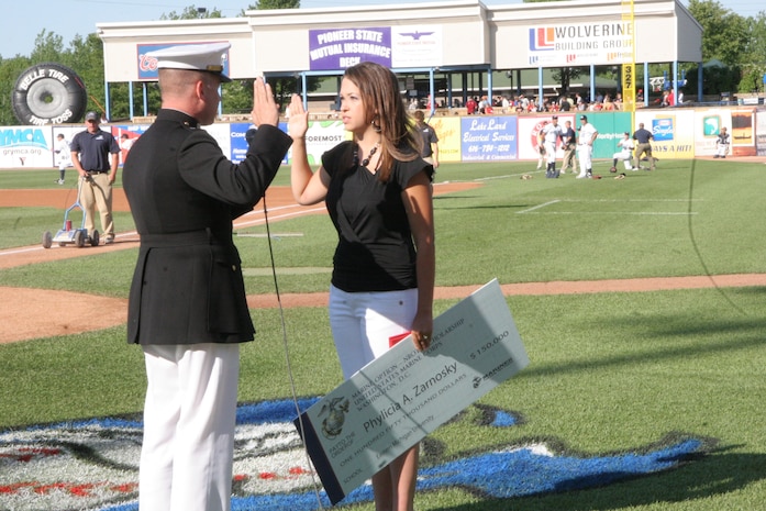 Phylicia Zarnosky, a native of Grand Rapids, MI, and 2008 graduate of Kenowa Hills High School, received a $150,000 scholarship from Capt. Paul Vanderwater, executive officer Recruiting Station Lansing, for her outstanding academics and leadership ability at the White Caps baseball game June 5, 2009. Out of over 230 applicants in the Midwest only 49 were awarded.