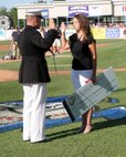 Phylicia Zarnosky, a native of Grand Rapids, MI, and 2008 graduate of Kenowa Hills High School, received a $150,000 scholarship from Capt. Paul Vanderwater, executive officer Recruiting Station Lansing, for her outstanding academics and leadership ability at the White Caps baseball game June 5, 2009. Out of over 230 applicants in the Midwest only 49 were awarded.