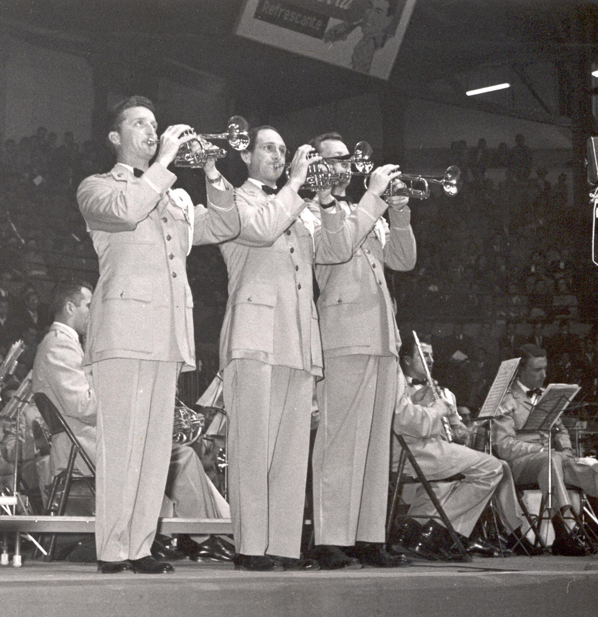 This photo is from a tour the band took to Quito, Ecuador in February of 1959.  Pictured are, from left to right: Jack Tardy, Art Will, and Delbert Dale. General information about the photo was found on the back of the photo with a special thanks to Mr. Harry Gleeson for providing names of the trumpet players.  In addition, thanks to Bruce Whitener for identifying the trumpet player whose face is obscured.