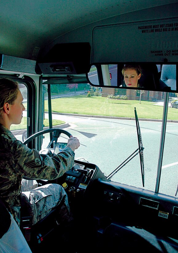 Staff Sgt. Jennifer Hall, 86th Aerial Port Squadron, McChord Air Force Base, Wash. drives a bus with 446th Security Forces Squadron members on board to Combat Arms Training and Marksmanship on Fort Lewis for some target practice.  Sergeant Hall is one of four Reserve transportation specialist supporting the 62nd Logistics Support Squadron here while its active-duty Airmen are deployed. (U.S. Air Force photo/Airman First Class Patrick Cabellon)