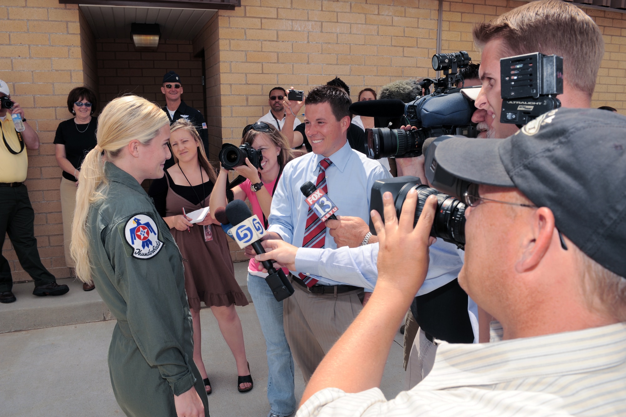 Megan Funk, a second grade teacher at Majestic Elementary School in Ogden, Utah, speaks with local media June 4 at Hill Air Force Base, Utah, before her Hometown Hero flight in a Thunderbird F-16 Fighting Falcon. (U.S Air Force photo/Tech. Sgt. Russ Martin)