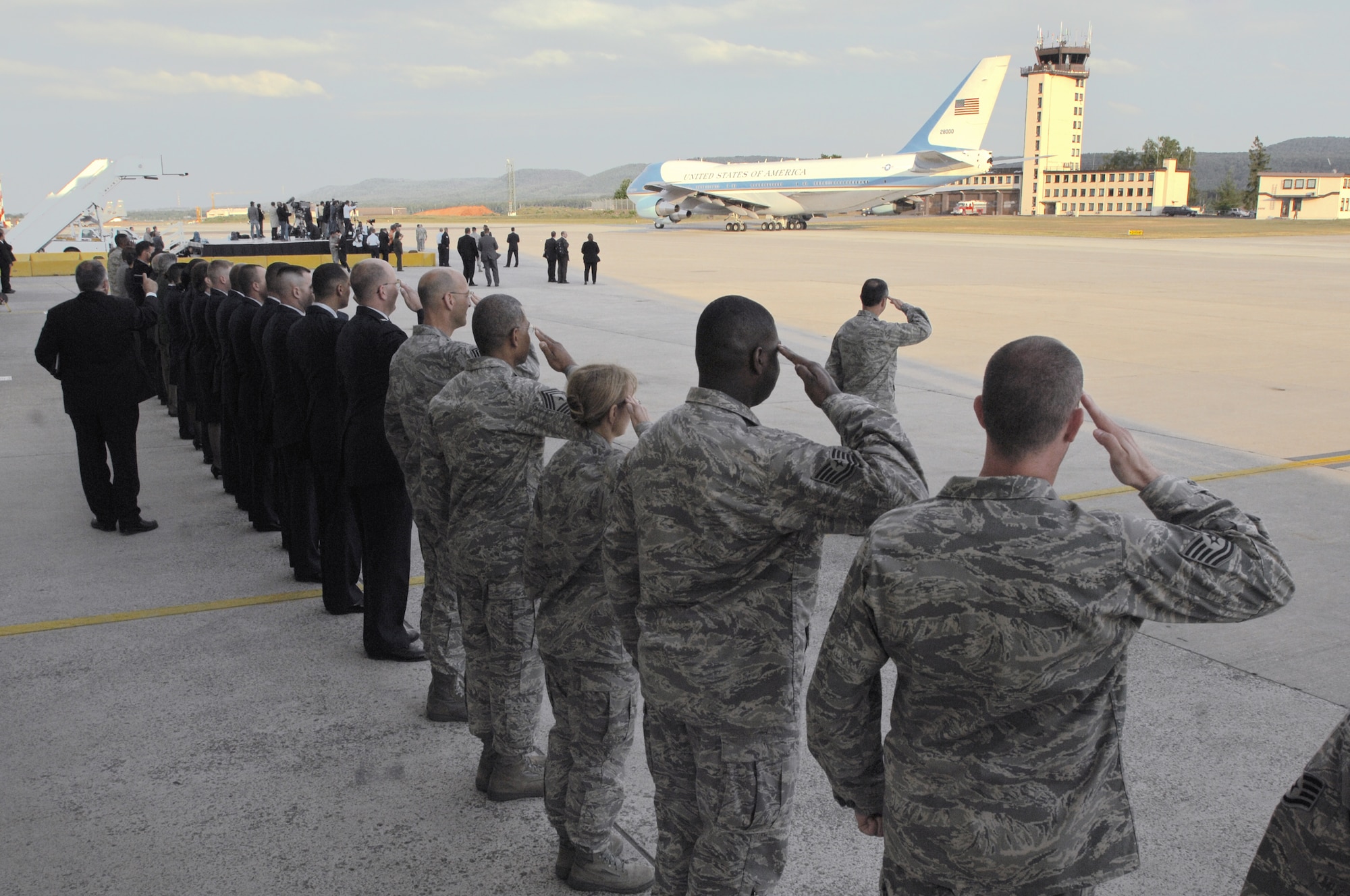 Airmen at Ramstein Air Base, Germany, salute Air Force One June 5 as it taxis for takeoff.  President Barack Obama had stopped at Ramstein en route to nearby Landstuhl Regional Medical Center to visit wounded U.S. servicemembers being treated there. (U.S. Air Force photo/Senior Airmen Kenny Holston)
