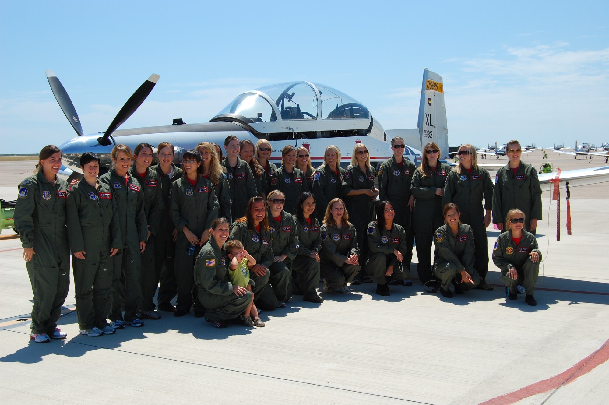 LAUGHLIN AIR FORCE BASE, Texas -- Twenty-nine instructor and student pilot spouses participated in the 84th Flying Training Squadron’s Spouse Taxi Event here May 29. “We really wanted to give member’s spouses a firsthand look at their spouse’s mission,” said Lt. Col. Timothy Biltz, 84th FTS commander. It was a full day for the spouses as they attended emergency egress training at the 47th Medical Group’s aerospace physiology, where they also received an orientation briefing in the altitude chamber. They also “flew” in the T-6 simulator, took pictures at a static display and received a tour of the control tower. After being fit for a harness and helmet, the spouses were buckled into the jet for a high-speed taxi ride down the runway. (Contributed photo) 