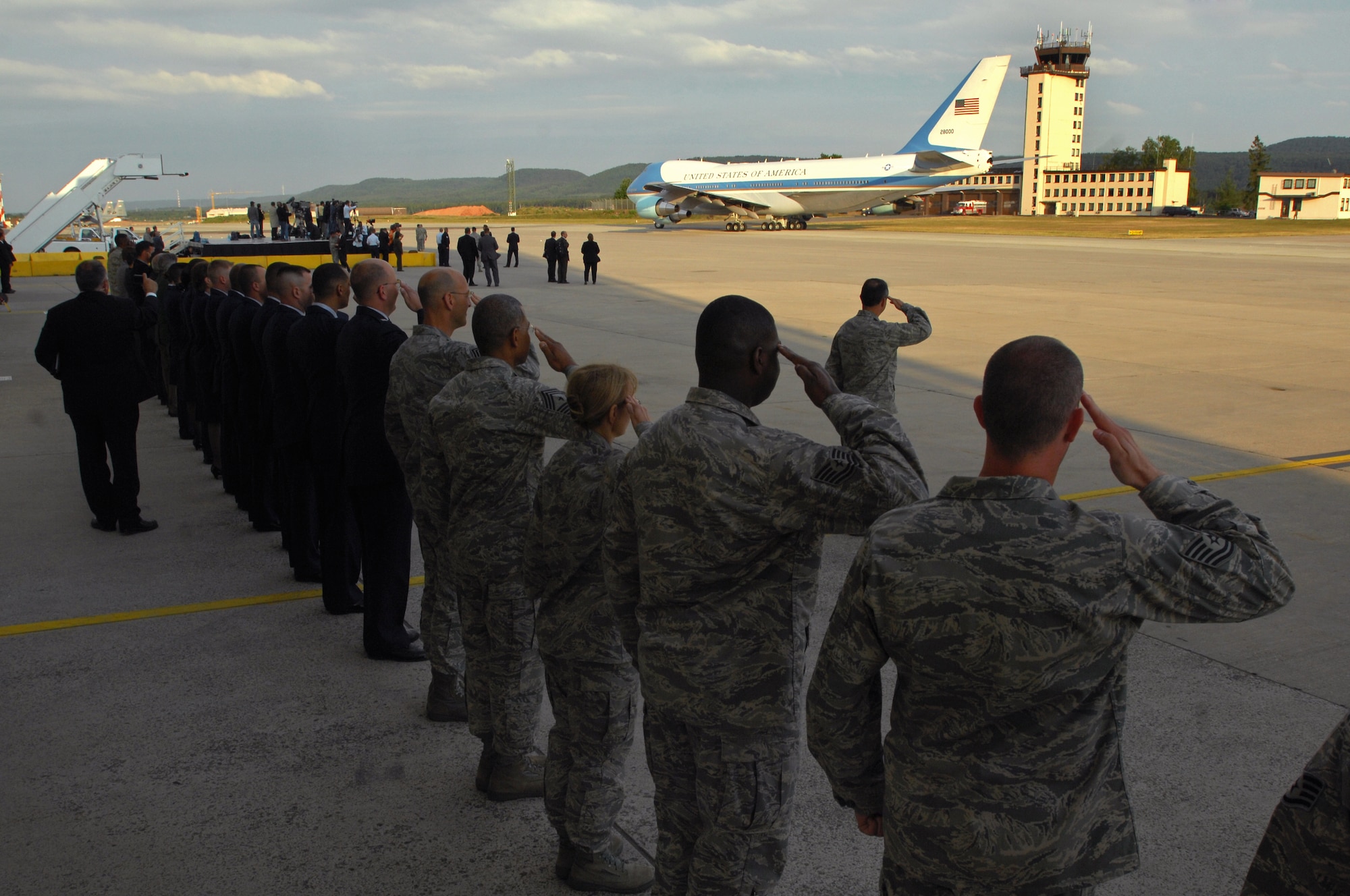 Ramstein Airmen salute Air Force One as it taxis for takeoff, June 5, 2009. President Barack Obama arrived at Ramstein en route to Landstuhl Regional Medical Center, Germany, to visit wounded U.S. military members being treated there. (U.S. Air Force photo by Senior Airman Kenny Holston) 
