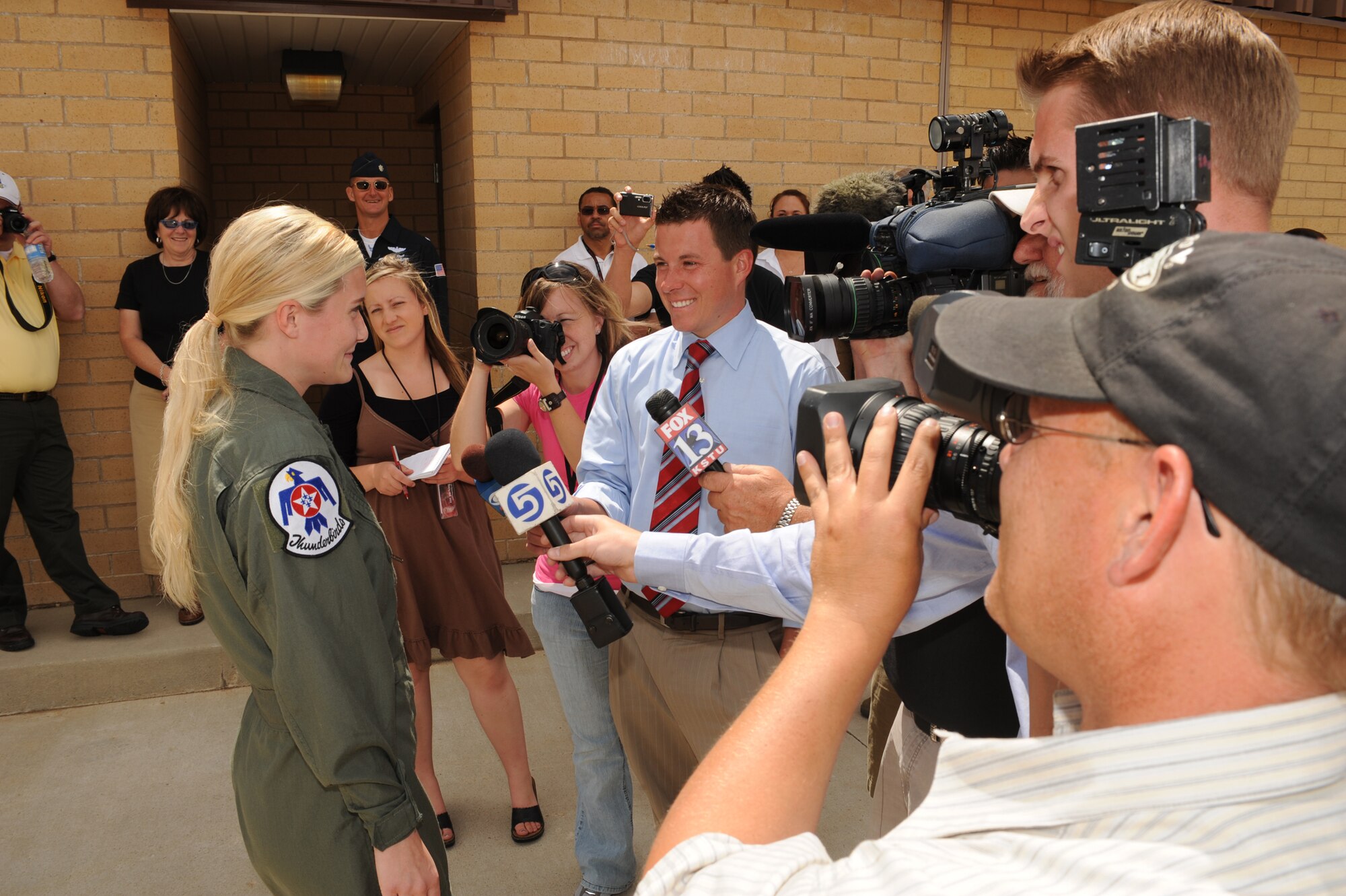 Megan Funk, Majestic Elementary School second grade teacher, speaks with local media before her Hometown Hero flight in a Thunderbird F-16 Fighting Falcon June 4 at Hill Air Force Base, Utah. (U.S Air Force photo by Tech. Sgt. Russ Martin)