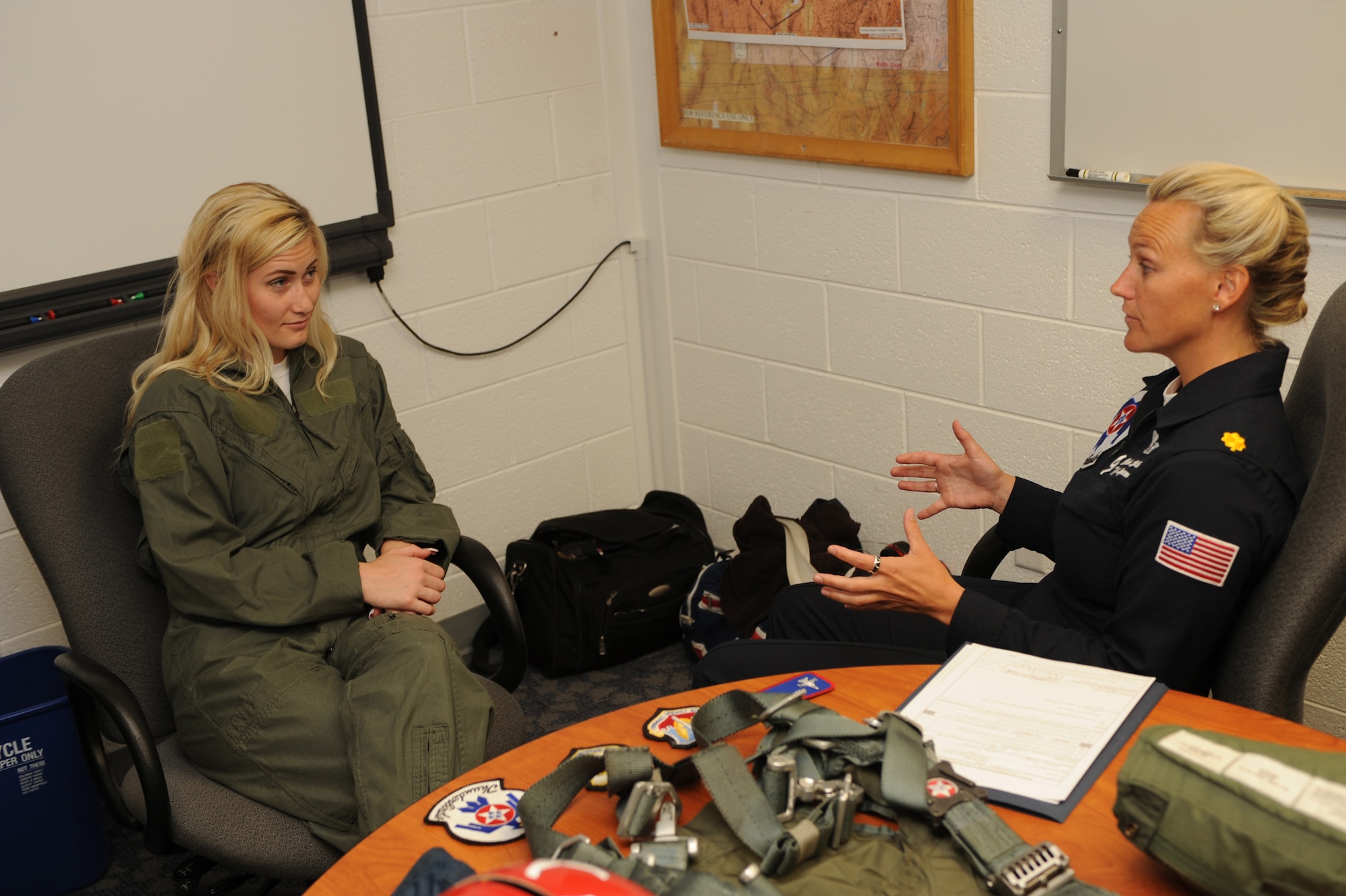 Local school teacher Megan Funk receives a medical screening from Maj. Charla Quayle, Thunderbird Flight Surgeon. Mrs. Funk had a total of 3 ½ hours of screening, training and briefings before she was cleared to fly in the back seat of a Thunderbird F-16 Fighting Falcon for her Hometown Hero flight June 4 at Hill Air Force Base, Utah. (U.S Air Force photo by Tech. Sgt. Russ Martin)