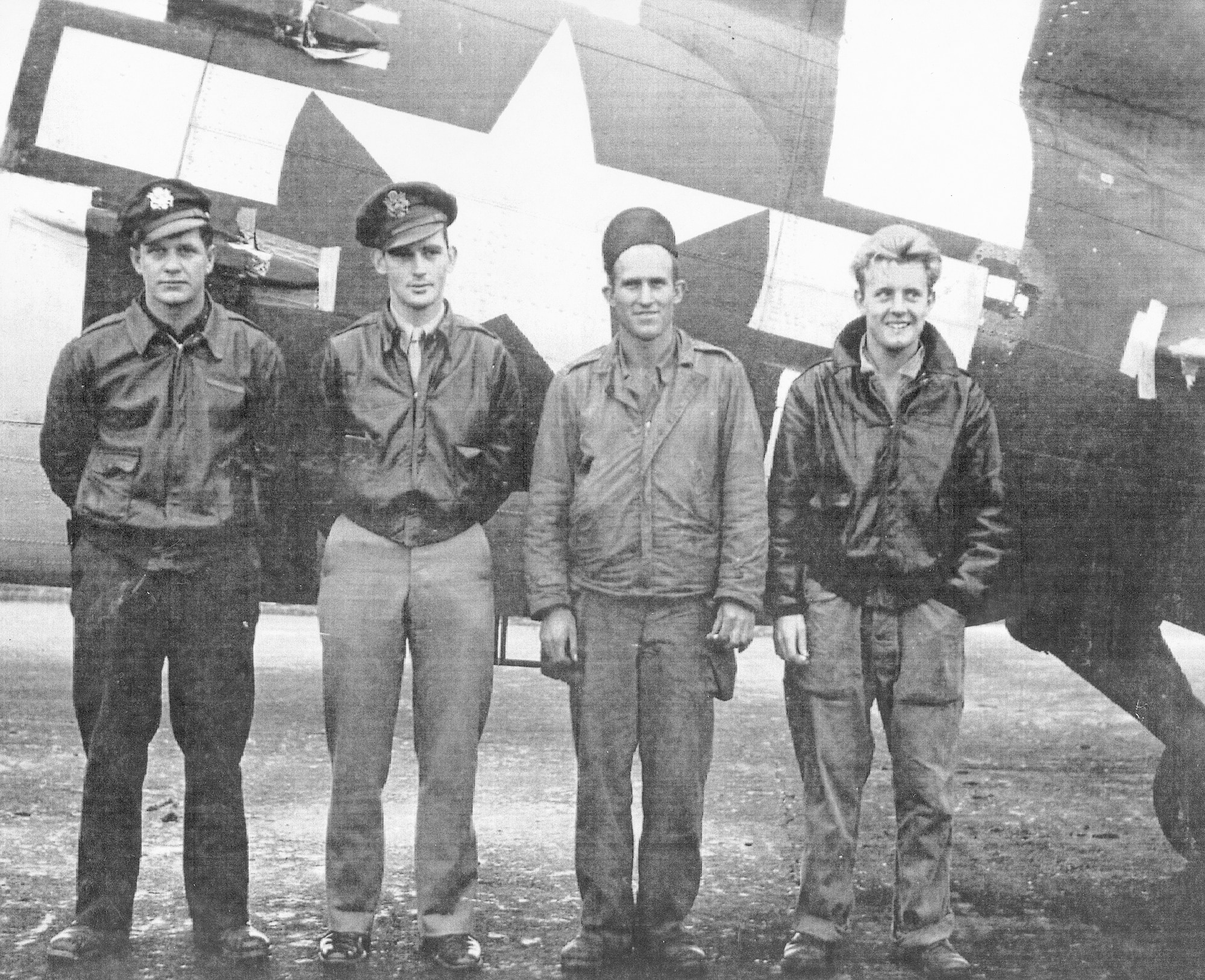 On ?D-Plus One," also known as the day after D-Day, four 305th Troop Carrier Squadron aircrew members pause between missions to pose for a photo in front of their C-47. From the left are Albert Maverick, III, Robert L. Tittle, Raymond E. Crocker and Gus King, Jr. The 305th TCS was one of four flying squadrons assigned to the 442nd Troop Carrier Group, the World War II predecessor of the 442nd Fighter Wing, an Air Force Reserve Command A-10 Thunderbolt II unit based at Whiteman Air Force Base, Mo. (Photo courtesy of the Herky Barbour estate)