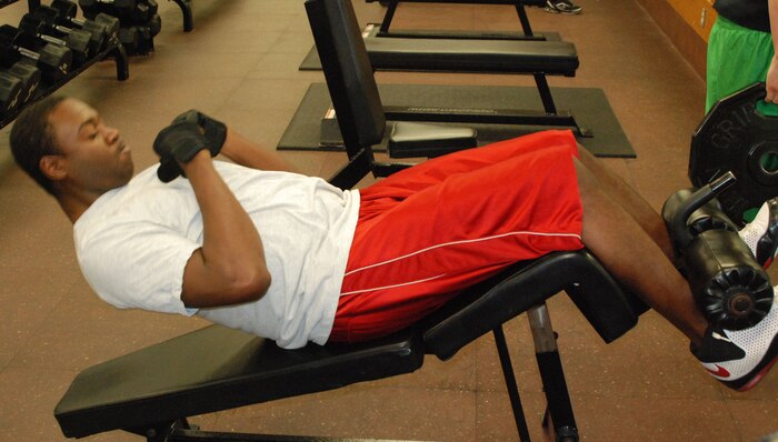 Airman 1st Class Corie Gibson, 9th Maintenance Squadron non-destructive inspection technician, performs core exercises June 3 at the Harris Fitness Center. Many Airmen perform daily workout routines to stay in top shape. (Photo by Airman 1st Class Chuck Broadway)