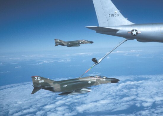Two F-4C Wild Weasel aircraft flying back to Kadena Air Base, Okinawa, after the war's end. The F-4C in the back, tail number 675, is being flown by Capt. Myers. (U.S. Air Force photo)