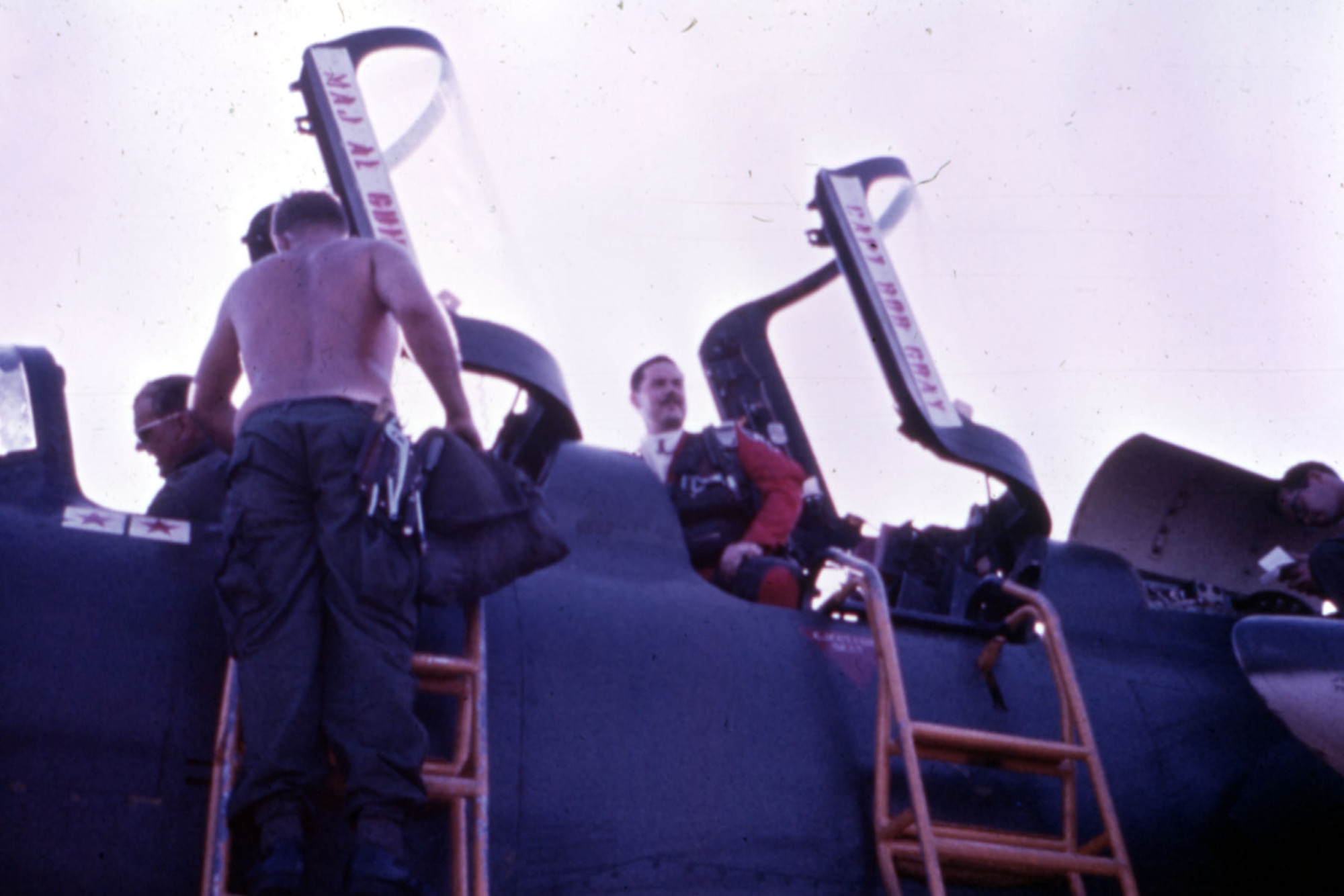 Capt. Robert “Butch” King (right) getting out of the museum’s F-105G after flying his last mission. On the way back from North Vietnam, he changed into the party suit on display. (U.S. Air Force photo)