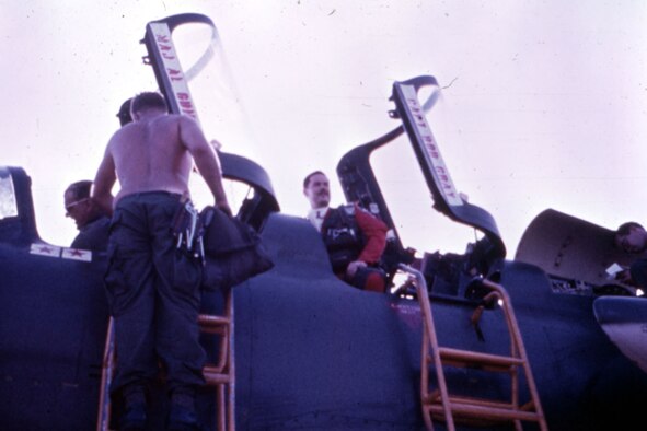 Capt. Robert “Butch” King (right) getting out of the museum’s F-105G after flying his last mission. On the way back from North Vietnam, he changed into the party suit on display. (U.S. Air Force photo)