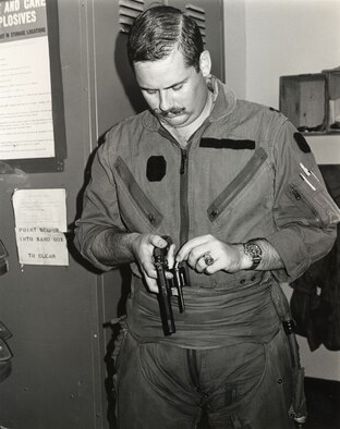 Capt. King with a “sanitized” K-2B flight suit. (U.S. Air Force photo)