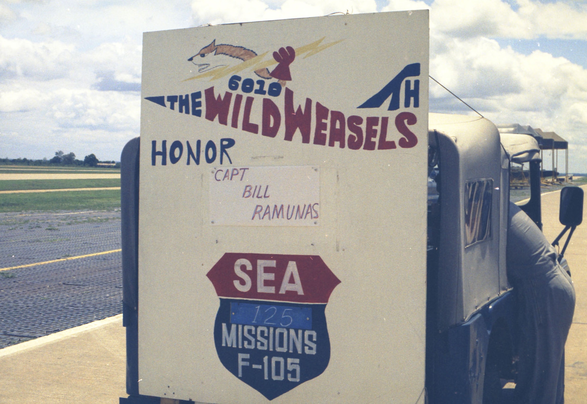 Sign from Capt. Vilius “Bill” Ramunas’ end of tour parade. Ramunas, an EWO, completed 125 missions. (U.S. Air Force photo)
