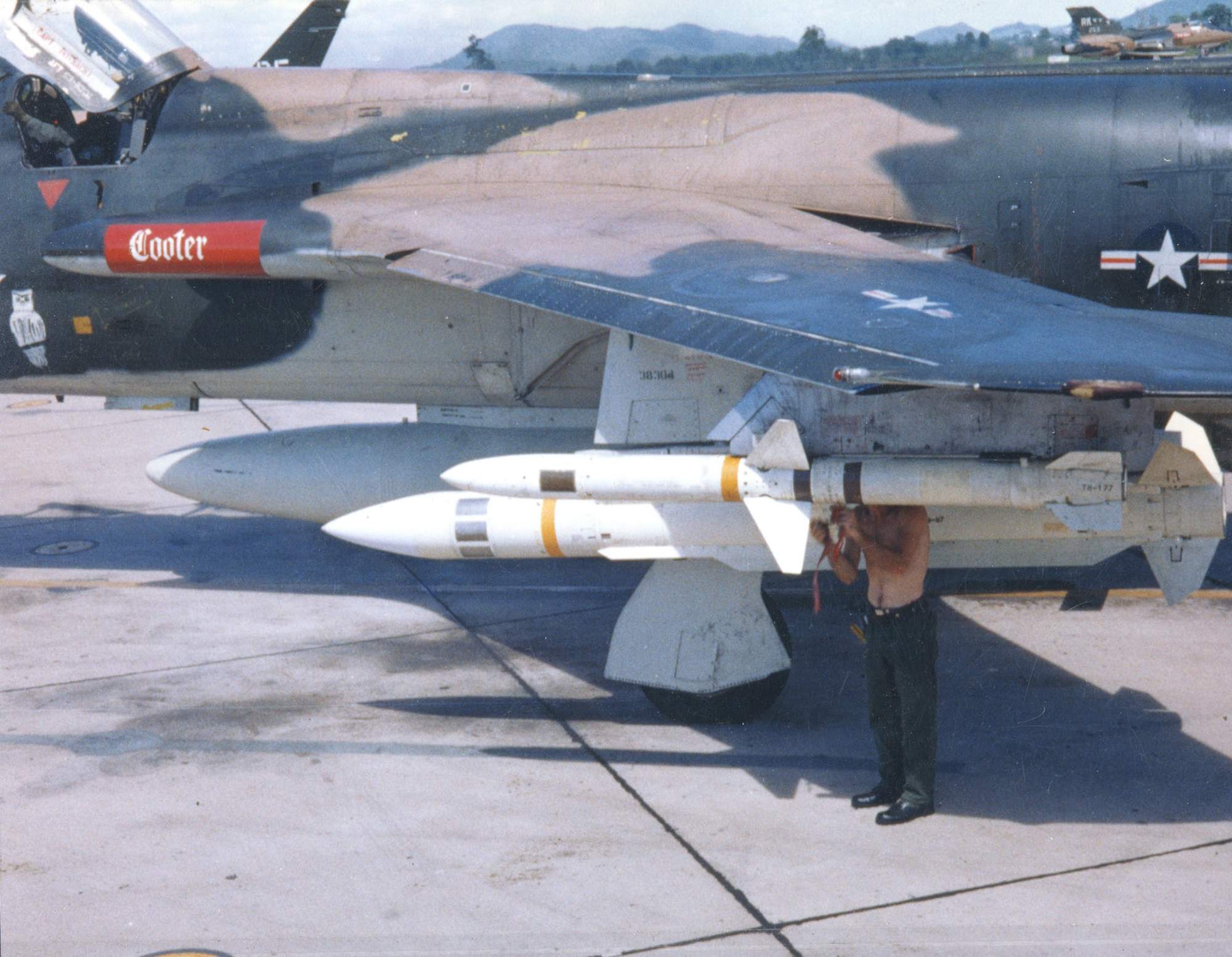 Armorer preparing a Shrike missile. Just behind him is a Standard missile. The aircraft is the museum’s F-105G, which was named Cooter before being renamed Bam Bam.