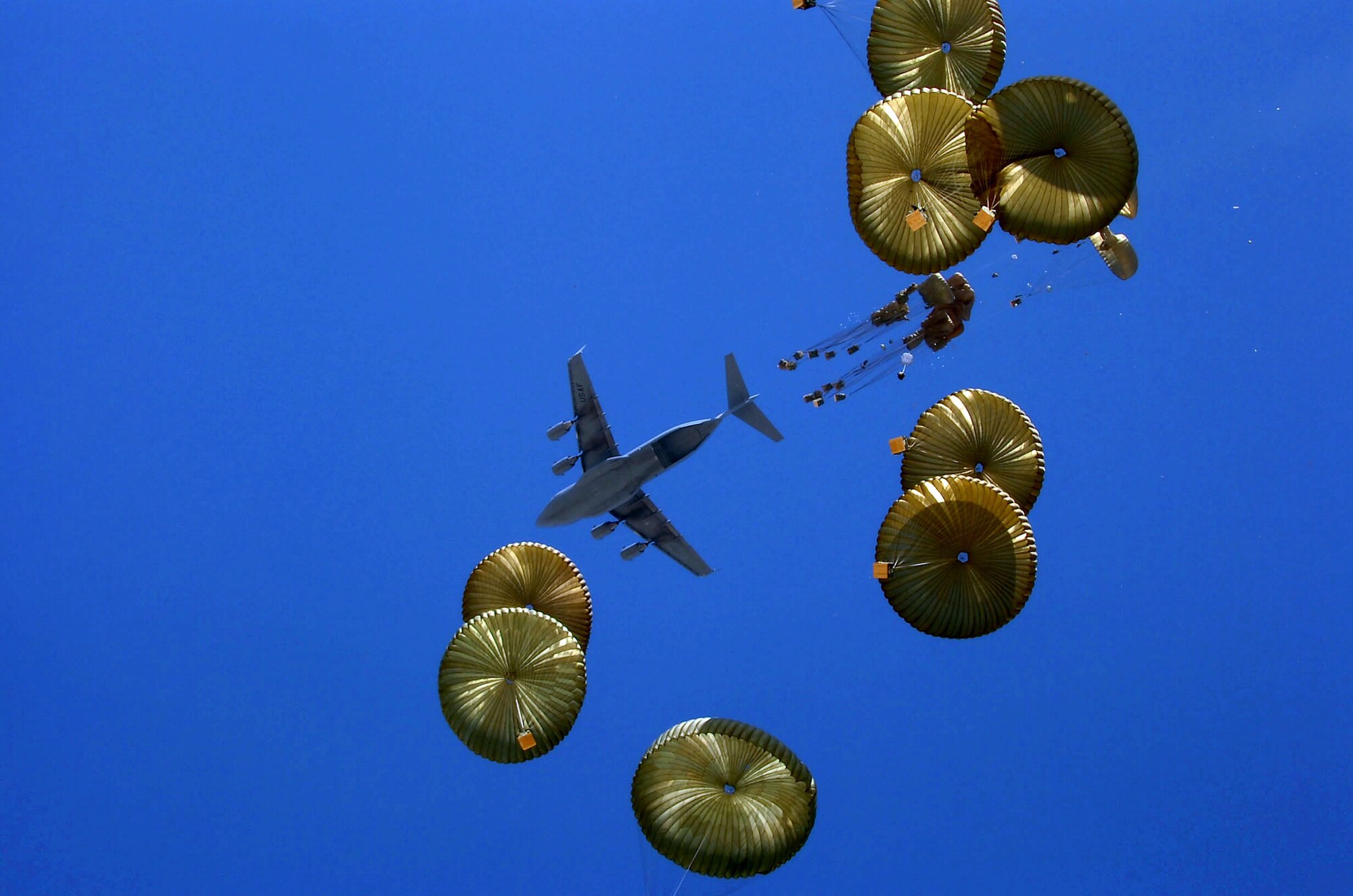 A C-17 Globemaster III aircrew executes an airdrop mission over Afghanistan. In 2008, Air Force aircraft dropped more than 15 million pounds of supplies in Iraq and Afghanistan. (U.S. Army photo/Spc. Micah E. Clare) 
