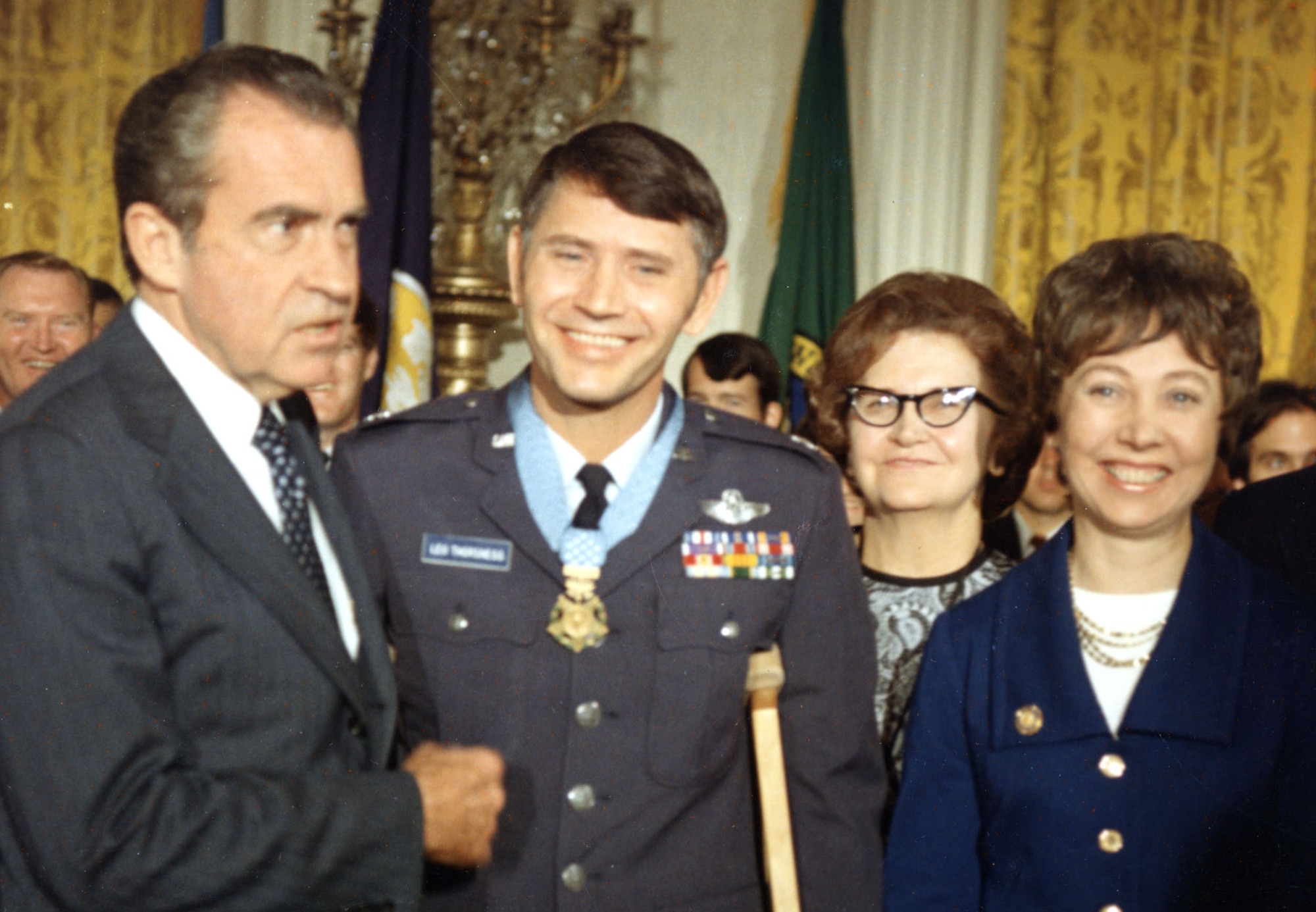 Pictured here is Col. Thorsness receiving the Medal of Honor from President Nixon after repatriation in 1973. Also pictured are his mother and his wife Gaylee. (U.S. Air Force photo)
