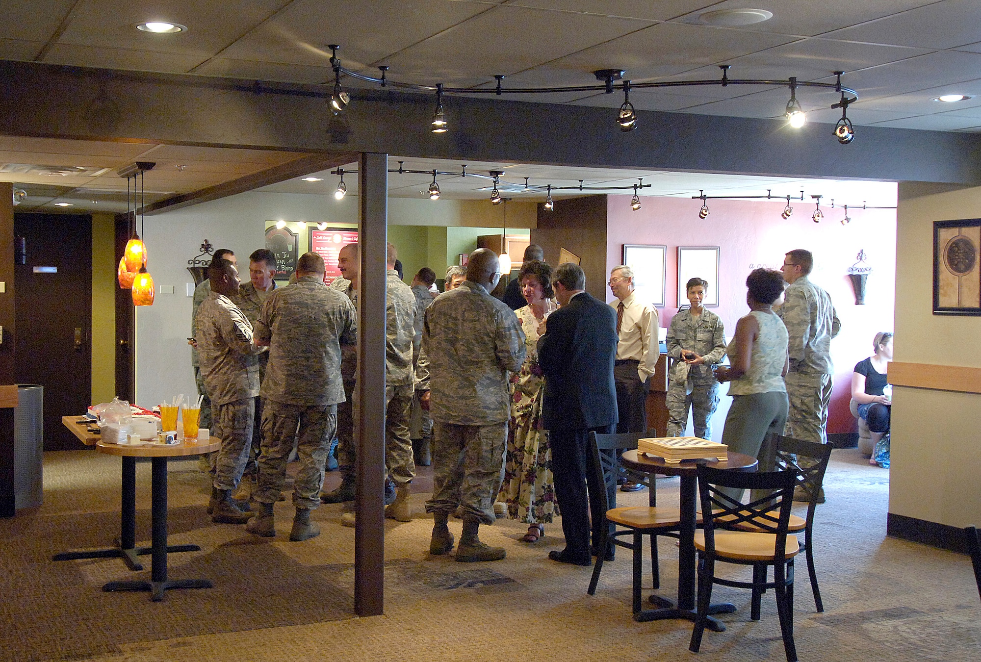 Smiles and free refreshments were on the menu during the official May 26 opening of the Latté Lounge — Airman’s Café. The lounge was a base chapel project that relied on volunteers to transform unused Loop Hall dorm rooms into an upscale retreat for Airmen offering free everything from pool tables, Wi-Fi, video games, live entertainment and specialty coffees, beverages and snacks. Chaplain (Capt.) Kelly Stahl was the backbone of the project and is grateful the new facility offers Airmen a safe and economical place to relax. Hours for the lounge are 6 to 10 p.m. Fridays and 2 to 10 p.m. Saturdays. For more information, call the chapel at 734-2111. (Air Force photo/Margo Wright)