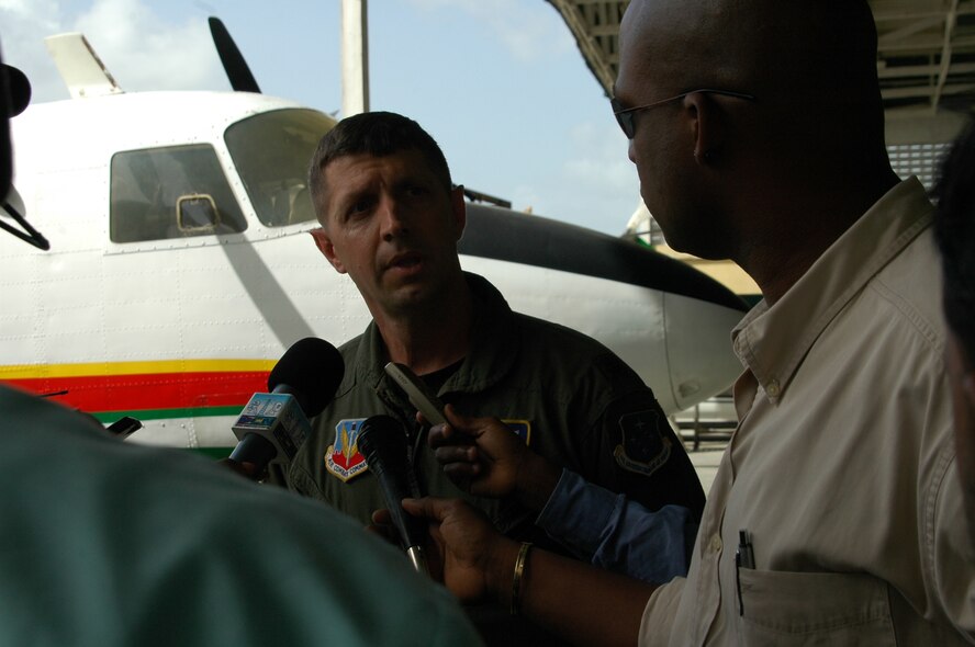 GEORGETOWN, Guyana -- Lt. Col. Robert Weaver, 12th Air Force flight safety officer, answers Guyanese reporters questions during interview at Cheddi Jagan International Airport June 2. Guyanese news media recieved an orientation and tour of a C-130J aircraft as part of  Operation Southern Partner activities in Guyana. More than 60 subject matter experts are participating in Operation Southern Partner at seven
locations throughout the Caribbean. (U.S. Air Force photo by Kevin Walston)