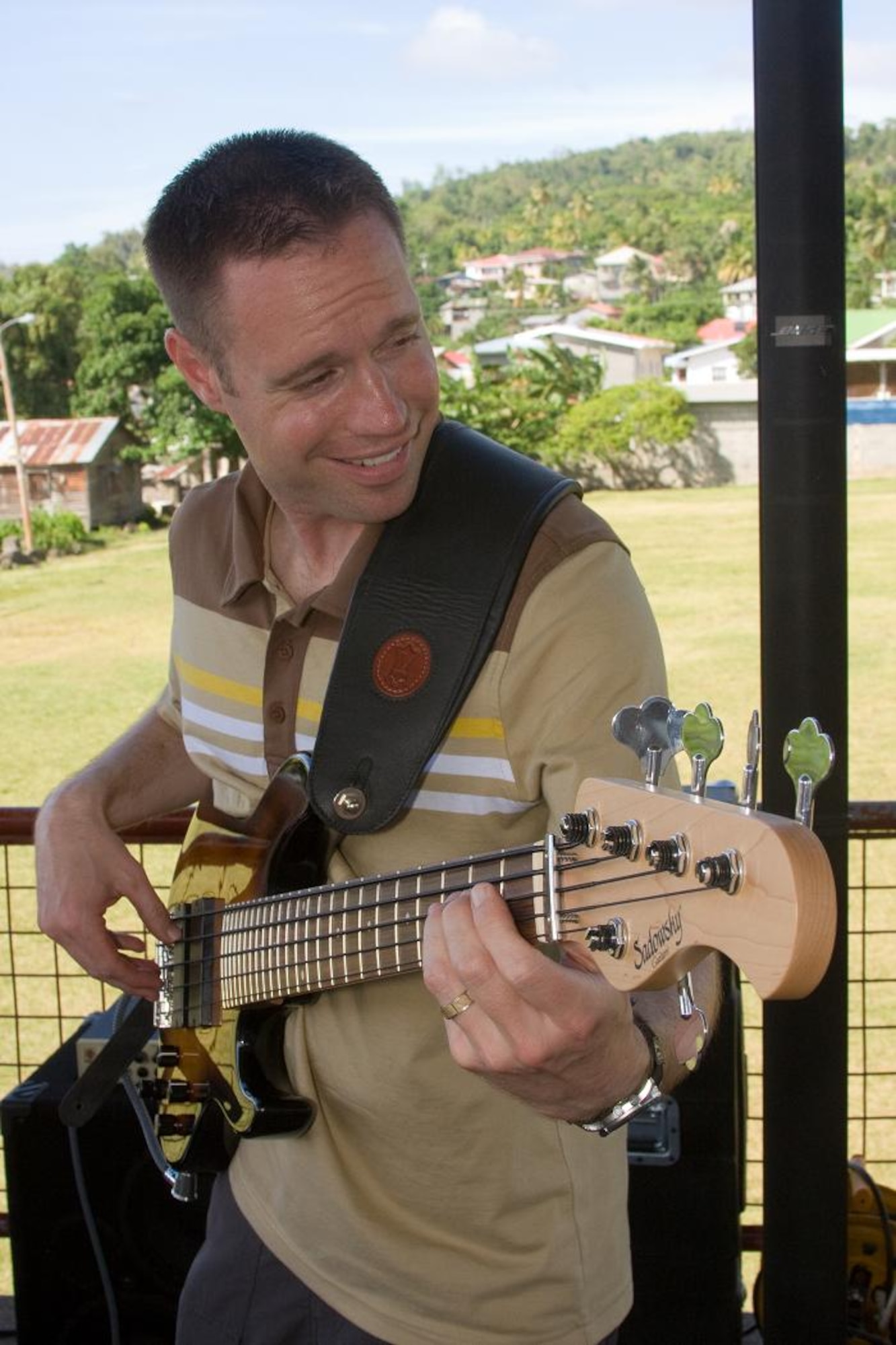 VICTORIA, Grenada -- Master Sgt. Jeremy Laukhuf, the bass player with the U.S. Air Force Academy Band “Blue Steel” performs in the park in Victoria, Grenada, June 1.  Blue Steel spent the day with orphans from Father Mallaghan’s Home for Boys before performing a public concert in the center of the village.  The community outreach event is part of Operation Southern Partner, an Air Forces Southern-led event aimed at strengthening partnerships with nations in the U.S. Southern Command area of focus through mil-to-mil subject matter exchanges.  In addition to the exchange program, Airmen also had the opportunity to volunteer at various charitable and community organizations in each host nation. (Photo courtesy of Sagar Pathak of HorizontalRain.com)