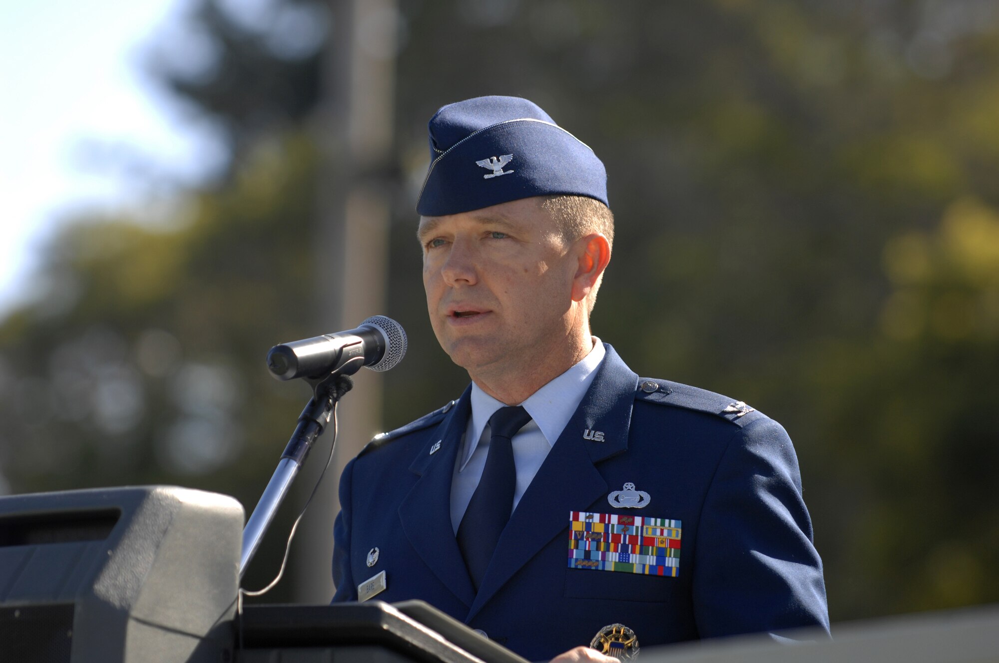Colonel William "Terry" Bare, 517th Training Group commander, delivers remarks at the stand-up of the 517 TRG at the Presidio of Monterey, Calif., May 15. The 517 TRG will encompass the 311th and 314th Training Squadrons and replaces the Air Force Element. (U.S. Air Force photo by Tech. Sgt. John Barton)