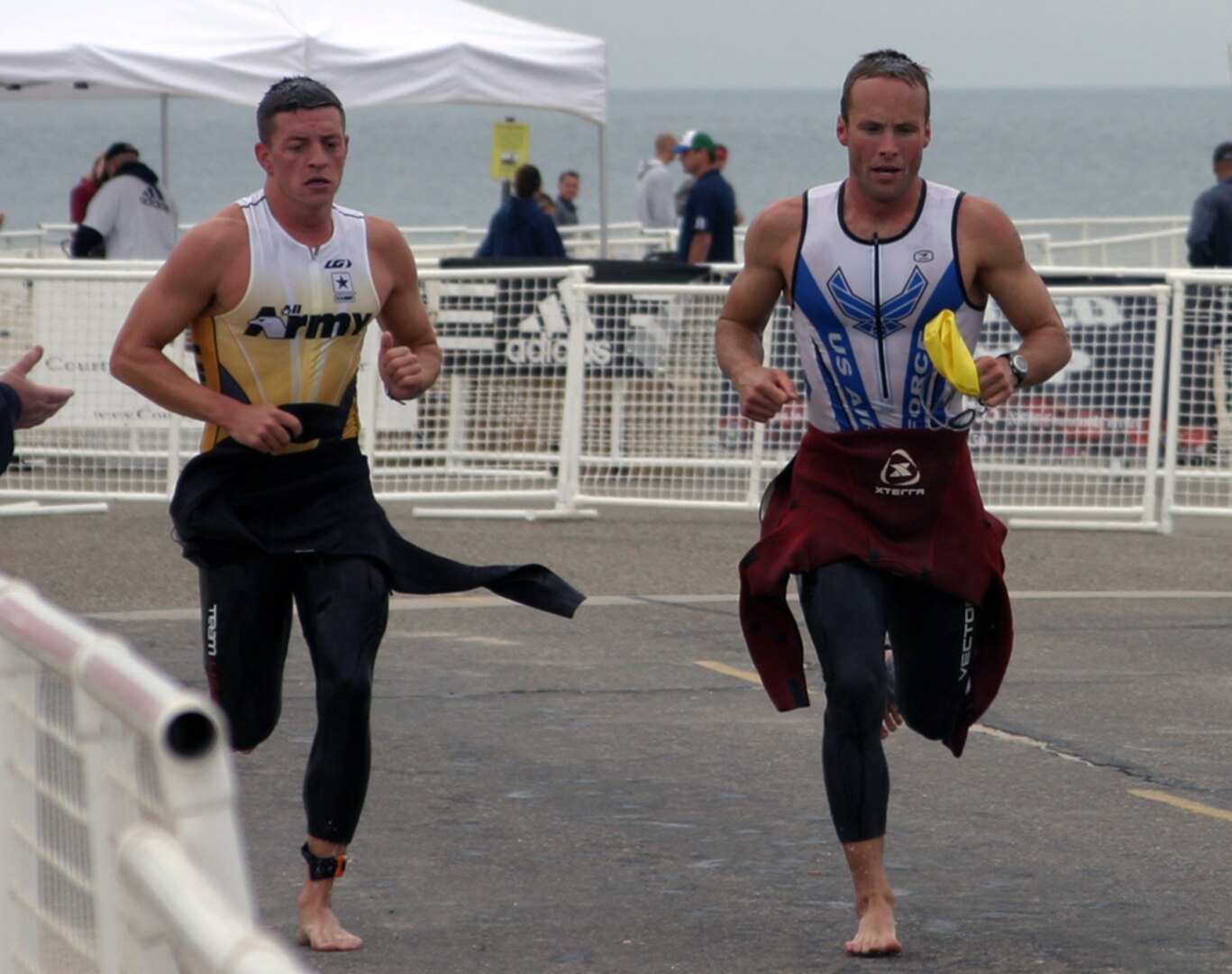 May 30, 2009 - Air Force triathlete James Bales (right) transitions from the 1,500-meter swim to thet 40K bike ride at the Armed Forces Triathlon in Point Mugu, Calif., May 30. (U.S. Air Force photo/Tech. Sgt. Elisha Abercrombie) 