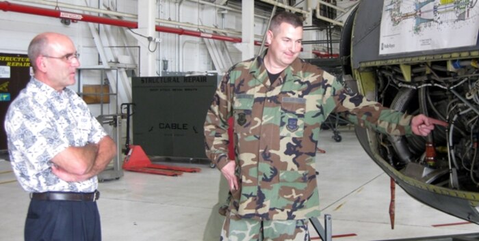 Tech. Sgt. James Hallmark, 107th Maintenance Squadron, Niagara Falls, NY, was proud to explain the components of the Rolls-Royce engine to Mr. Richard Hopf, production supervisor of GE Energy.  Mr. Hopf participated on the Employer Support of the Guard and Reserve Bosslift trip taken to Niagara Falls to see a military mission first-hand.  (U.S. Air Force photo / Debra Baldwin)