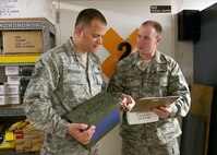 Master Sgt. Adolfo Gonzalez and Staff Sgt. Vincent Houseknecht, Air Force Safety Academy students, verify that the bullets used by security forces are identified on the explosive safety license while doing inspections at the Security Forces Armory. (U.S. Air Force photo/Robbin Cresswell) 